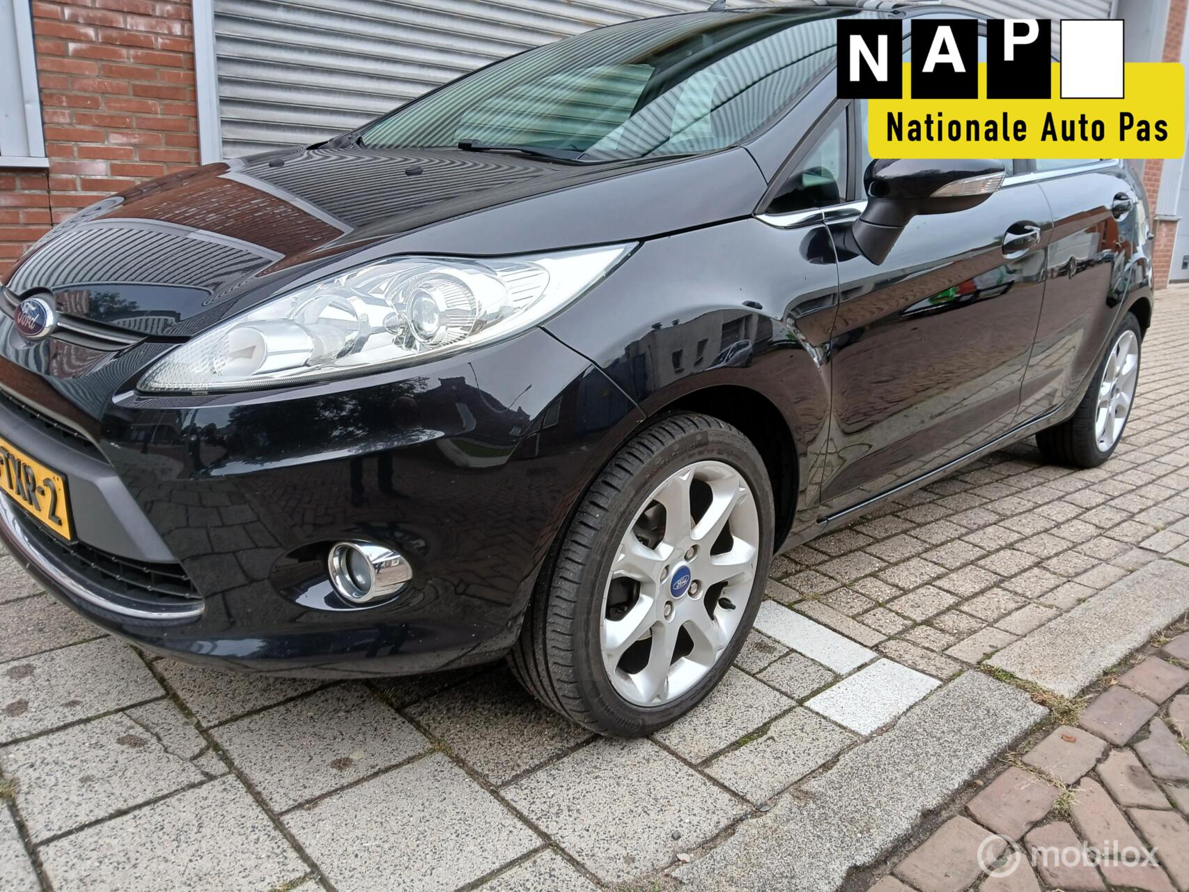 Ford Fiesta 1.25 Titanium NAP APK AIRCO LEER STOELVERWARMING NETTE AUTO! 2012 - voorkant