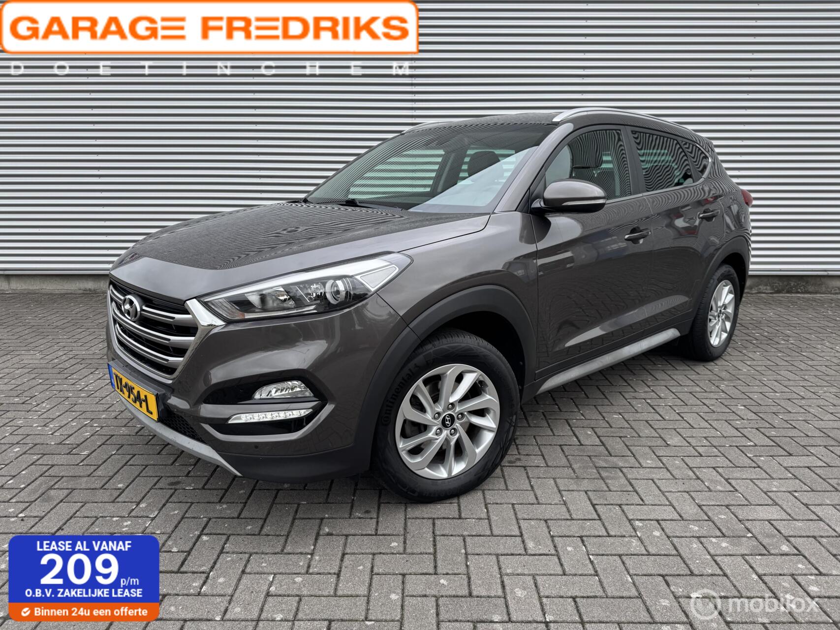 Hyundai Tucson 1.6 GDi Premium | Navigatie | Stoelverwarming | 2017 - voorkant