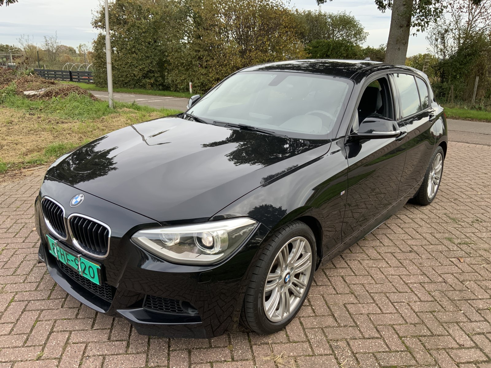 BMW 1-serie 116i Executive 2014 - voorkant