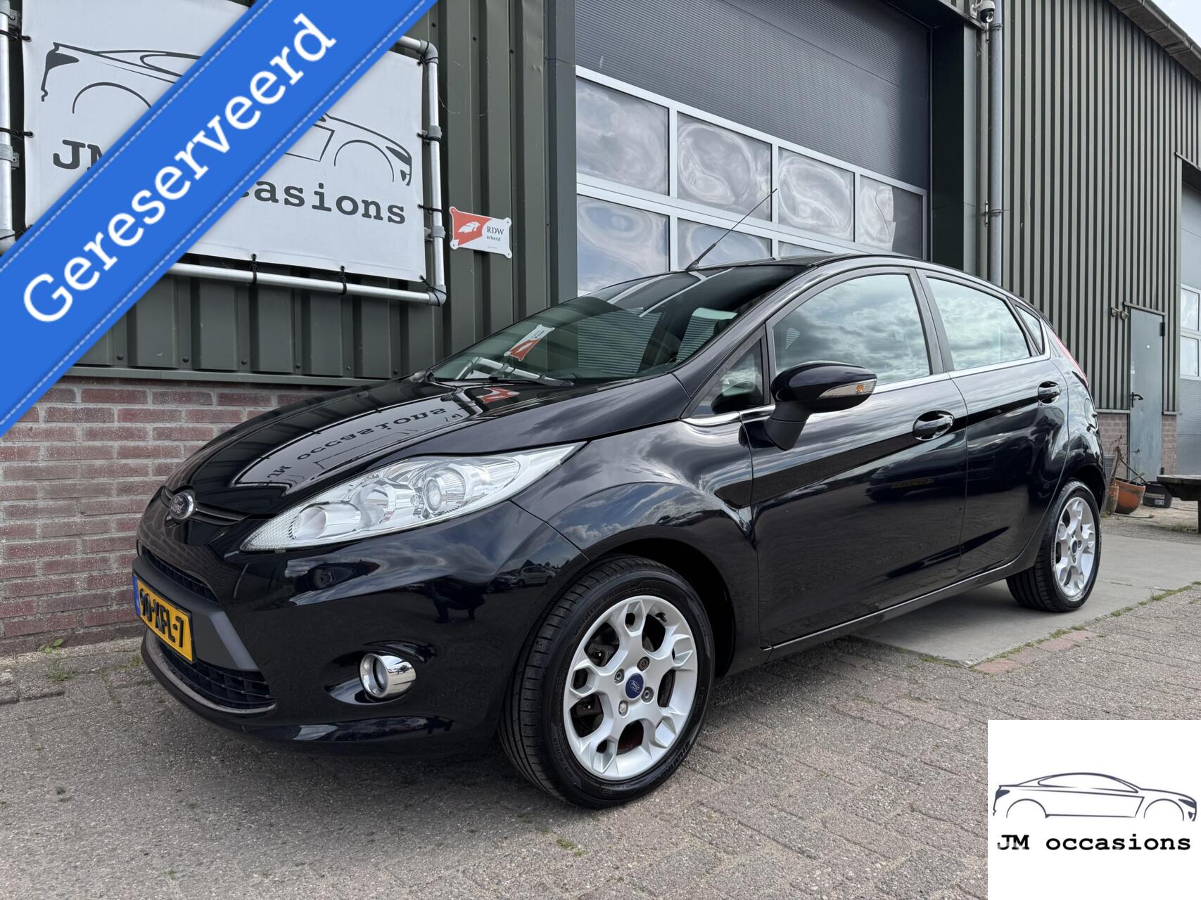 Ford Fiesta 1.25 Titanium|Cruise|Clima|Bleutooth|APK2-2026| 2012 - voorkant