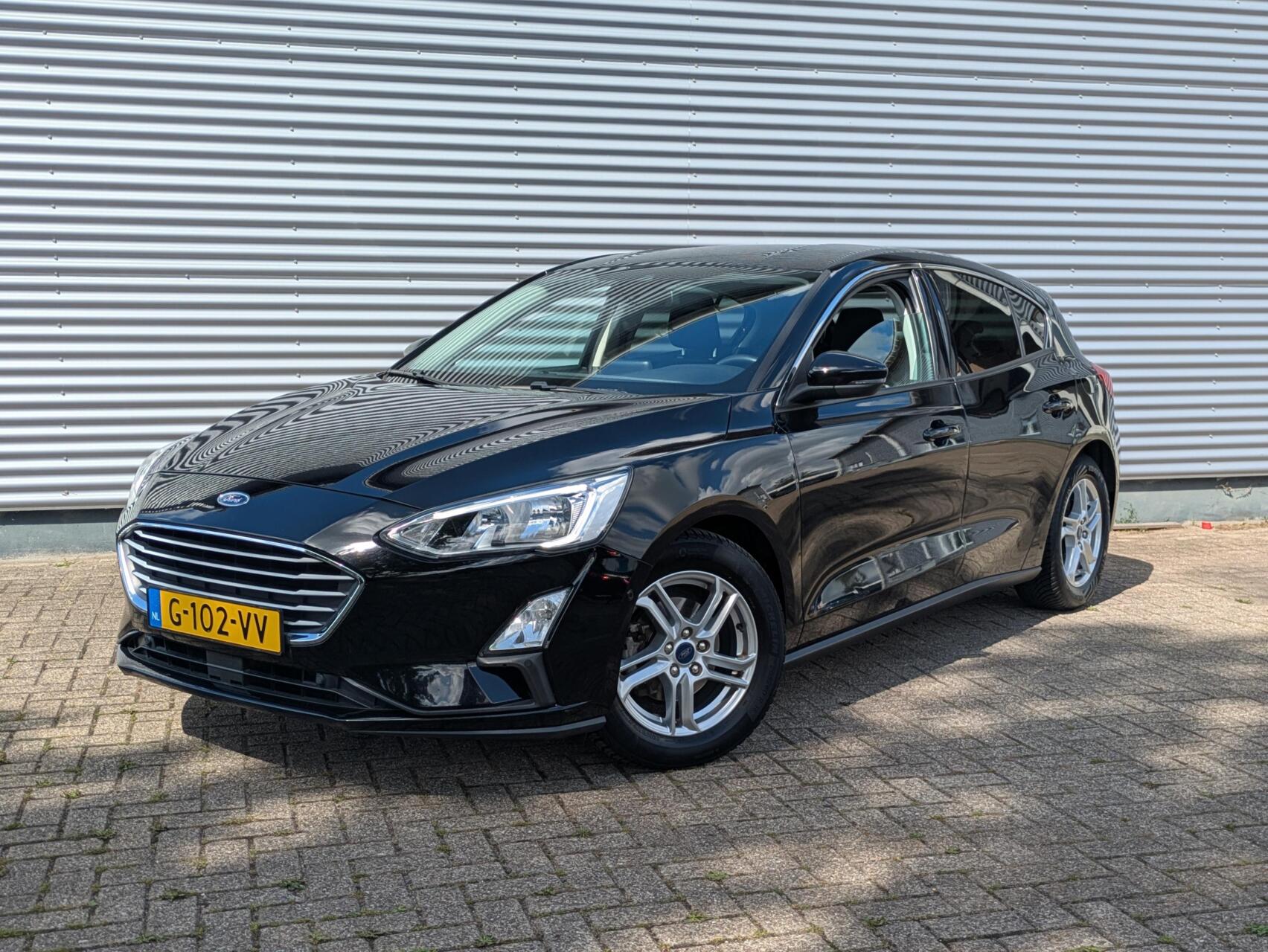 Ford Focus 1.0 EcoBoost Titanium Business // Camera - Navi. - Winter Pack (Voorruit- en stoelverwarming) - CarPlay & Android Auto 2019 - voorkant
