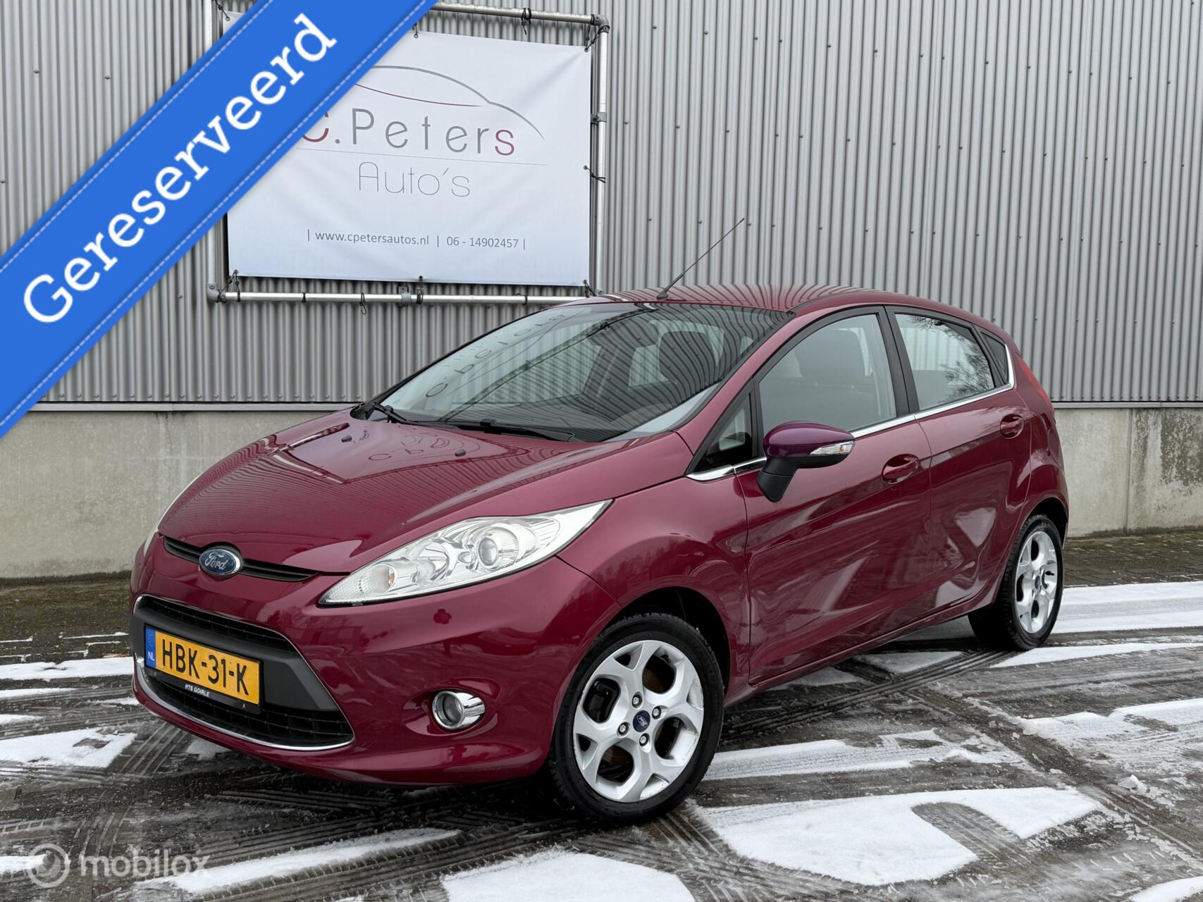 Ford Fiesta 1.25 Titanium 82pk / Climate Airco / Voorruitverwarming / Stoelverwarming / LM Velgen / NAP 2009 - voorkant