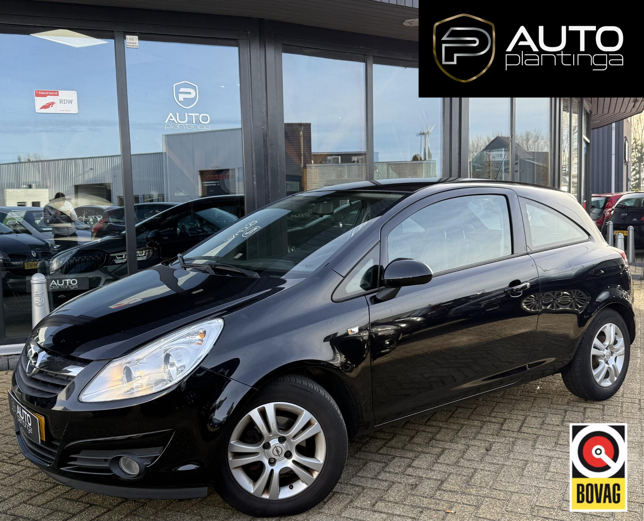 Opel Corsa 1.4-16V Business 2009 - voorkant