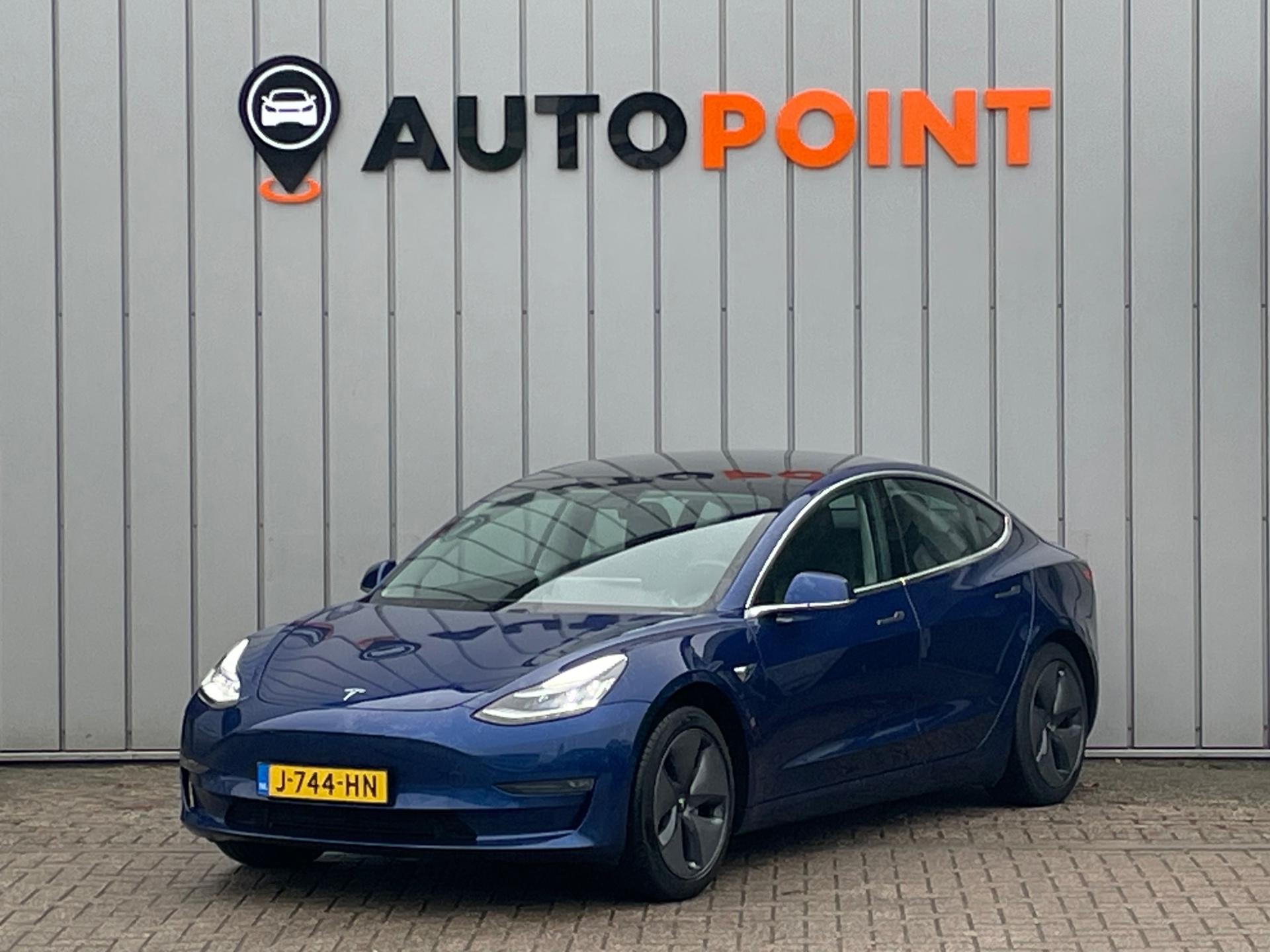 Tesla Model 3 Long Range 75 kWh AWD|DUALMOTOR|ORG.NL|PANO|AUTOPILOT|MEMORYSEATS|STOELVRM|CAMERA|LANE ASSIST|LEER|LED|APPLECARPLAY 2020 - voorkant