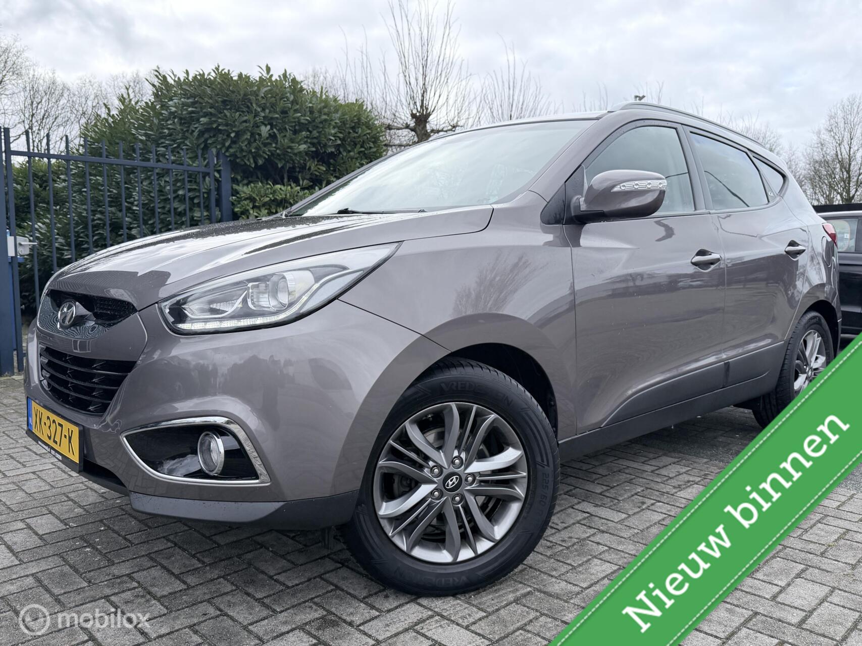 Hyundai Ix35 1.6i GDI i-Catcher NAVI / CLIMATE / CAMERA / LED / TREKHAAK / NETJES 2013 - voorkant