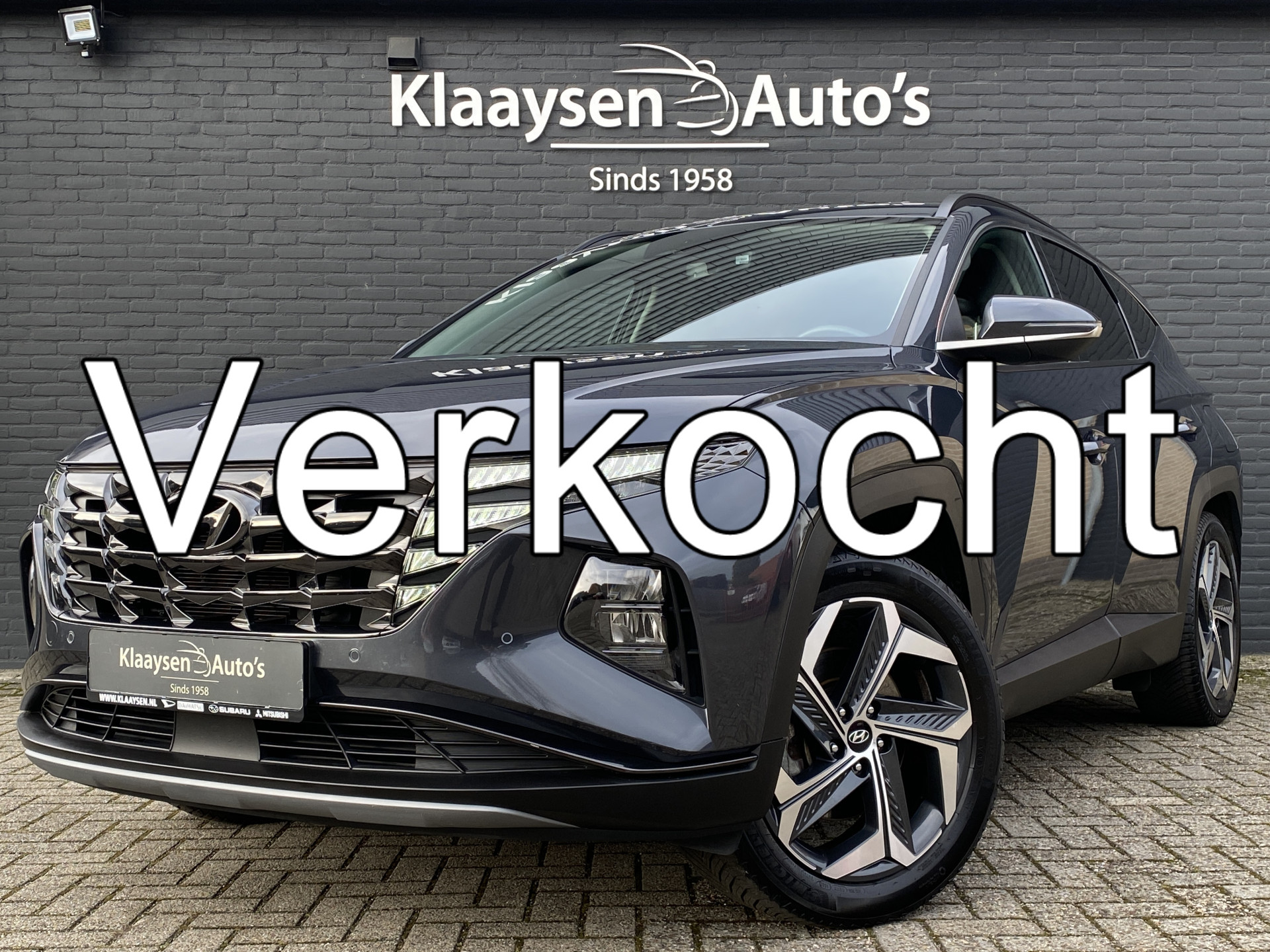 Hyundai Tucson 1.6 T-GDI PHEV Comfort Smart 265 pk 4WD AUT. | 1e eigenaar | dealer onderhouden | trekhaak | navigatie | elektr. a. klep 2022 - voorkant