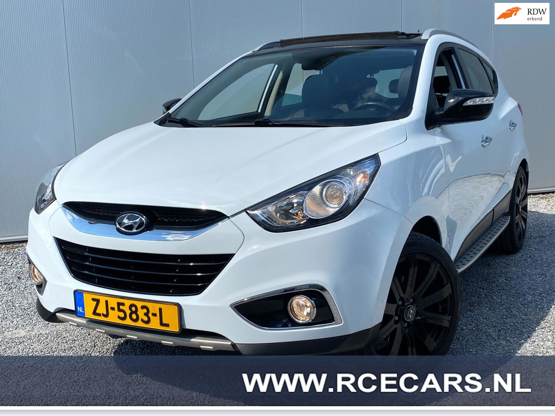 Hyundai Tucson 2.0i 4WD i-Catcher Pano Opendak  Leder Cruise clima camera 4xstoelverw Navi 2011 - voorkant