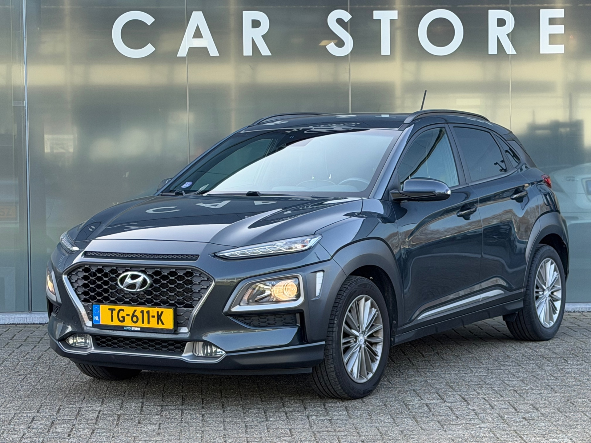 Hyundai Kona 1.0T Fashion TREKHAAK CAMERA CARPLAY 2018 - voorkant