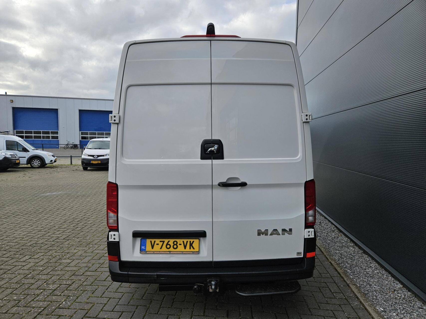 Foto van Man Tge