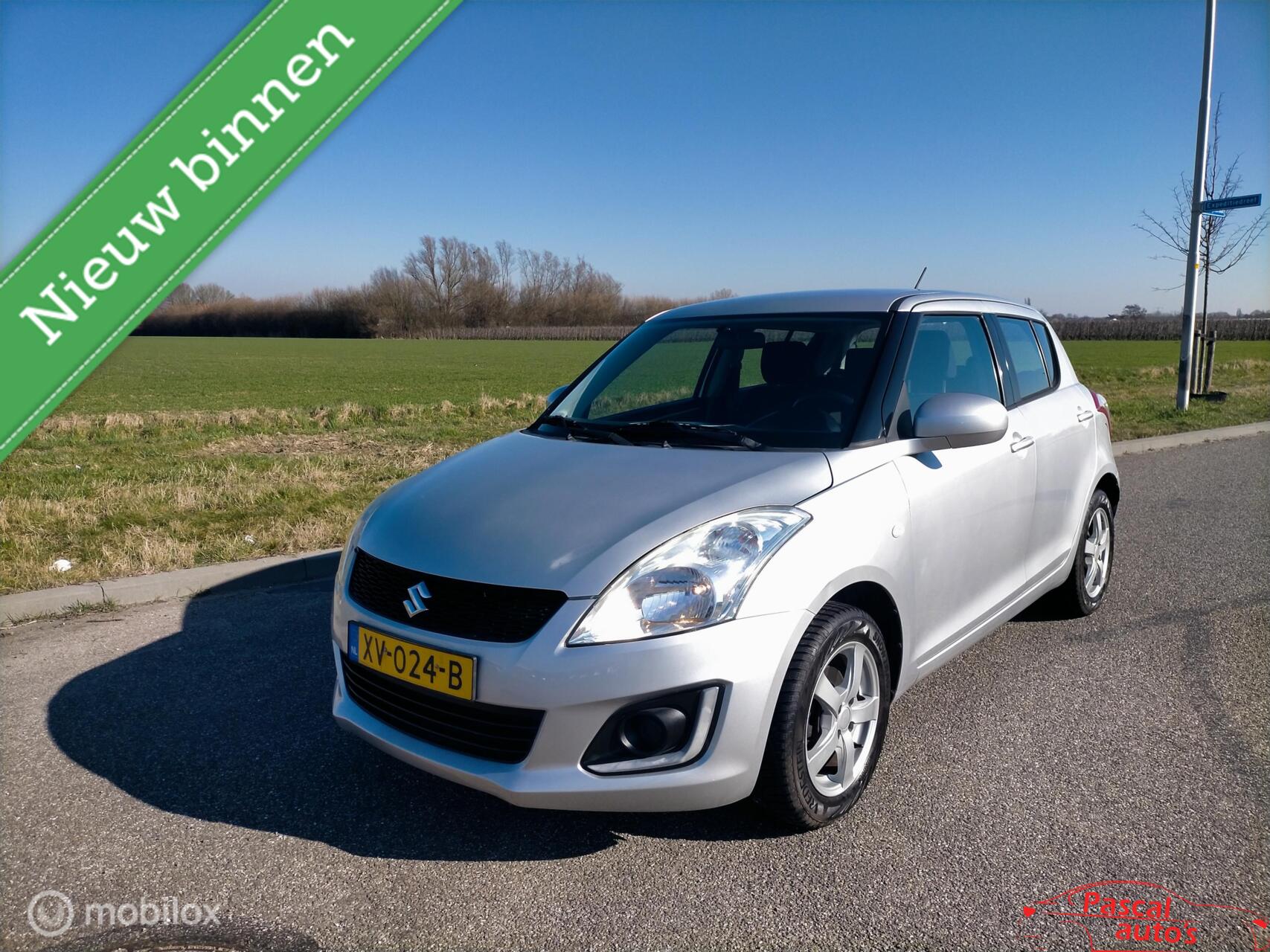 Suzuki Swift 1.2 Style EASSS airco lm velgen 4S banden 2015 - voorkant