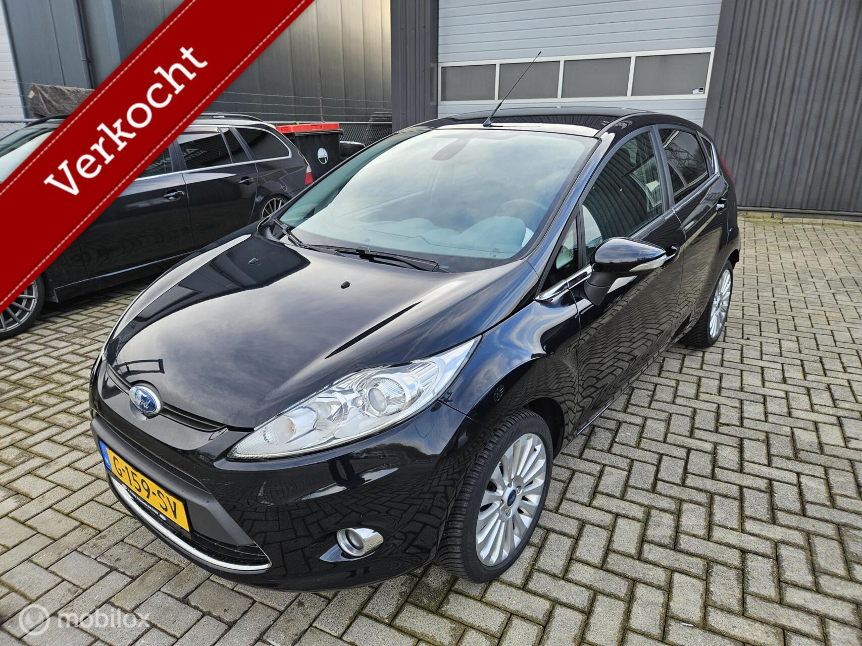 Ford Fiesta 1.4 Ghia AIRCO APK 03/2027 DEALERONDERHOUDEN VASTEPRIJS 2009 - voorkant