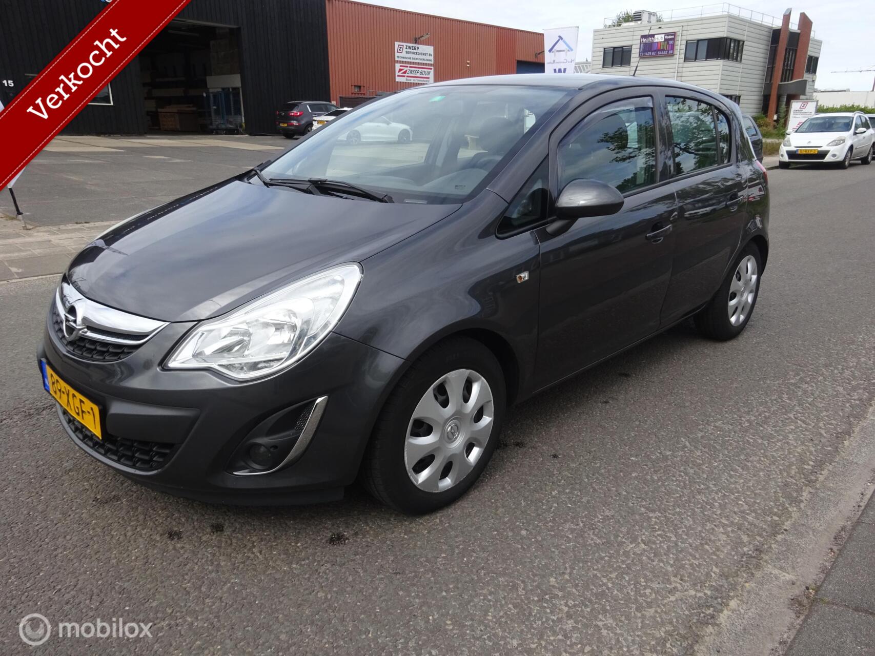 Opel Corsa 1.2 Ann Ed!/CRUISE/AIRCO/TREKHAAK/HALF LEDER!! 2012 - voorkant
