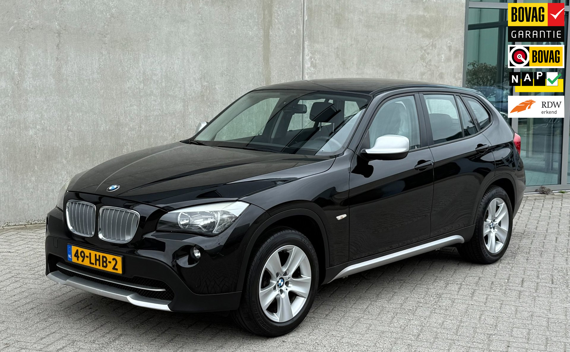 BMW X1 sDrive 18i SDrive18i 150pk 2010 Zwart NAP|TREKHAAK|APK 2027 2010 - voorkant