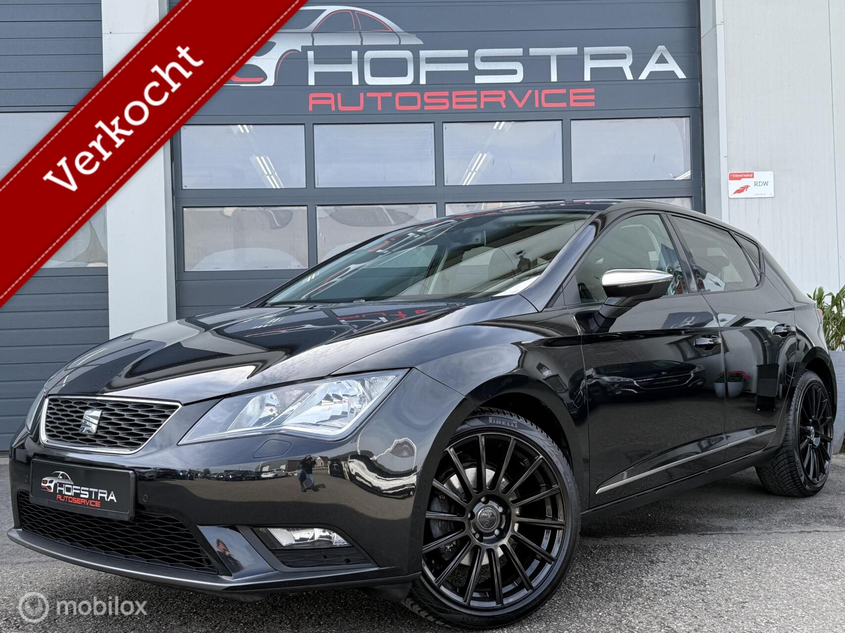 Seat Leon 1.2 TSI Style Trekhaak 18inch Navi PDC Stoelverw Clima 2013 - voorkant