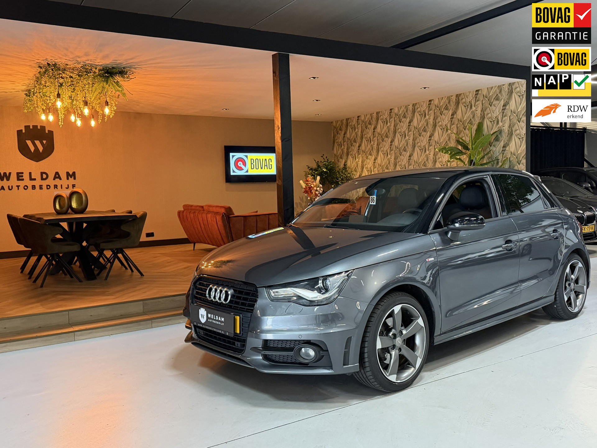 Audi A1 Sportback 1.4 TFSI S-Line|Xenon|NAP|NL-Auto|Half Leder|Navi|Cruise|PDC|Zwart Dak|Rijklaar 2014 - voorkant