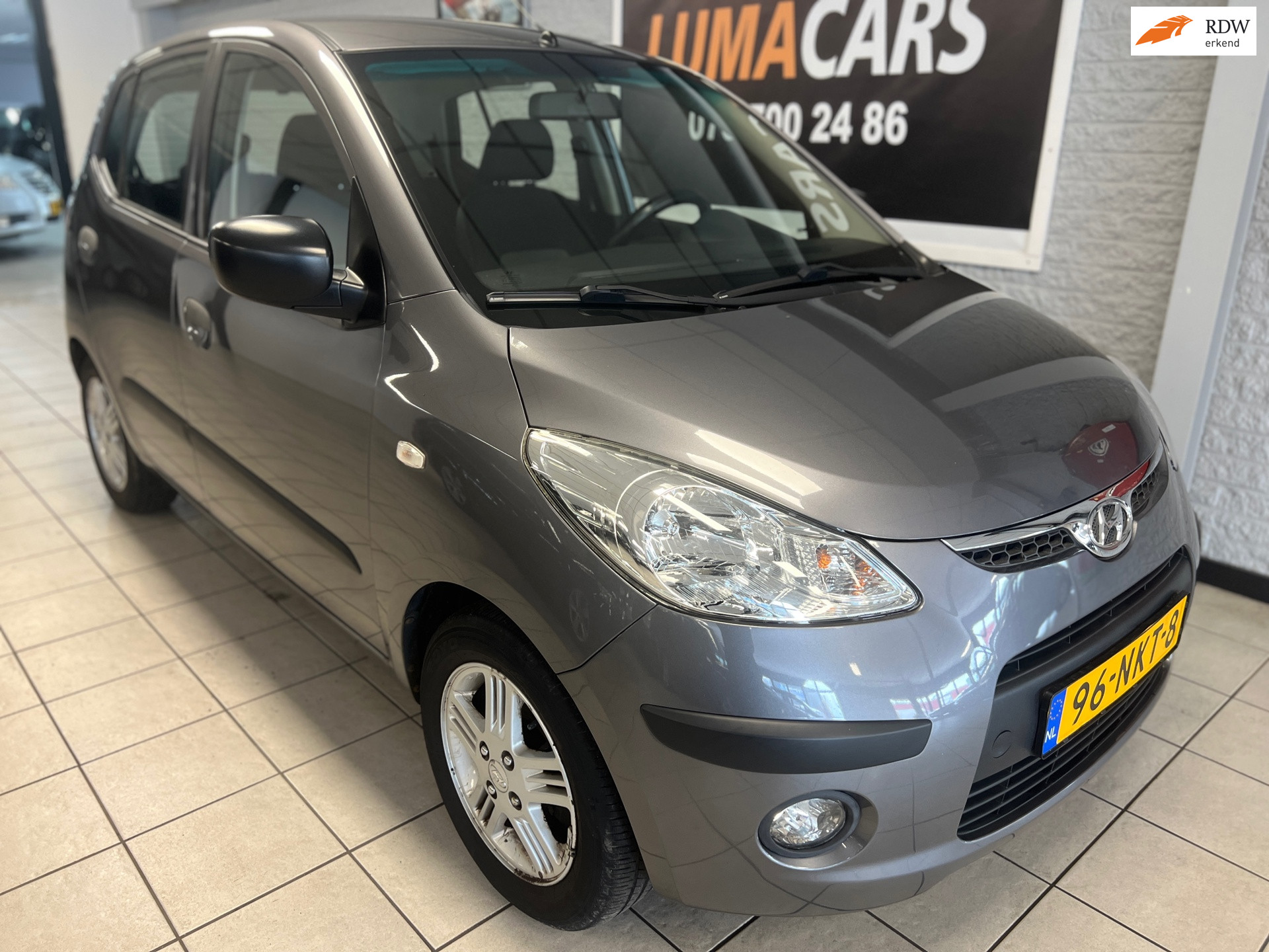 Hyundai I 10 1.1 Active Orange Babies |Airco|5-deurs|Trekh. 2010 - voorkant