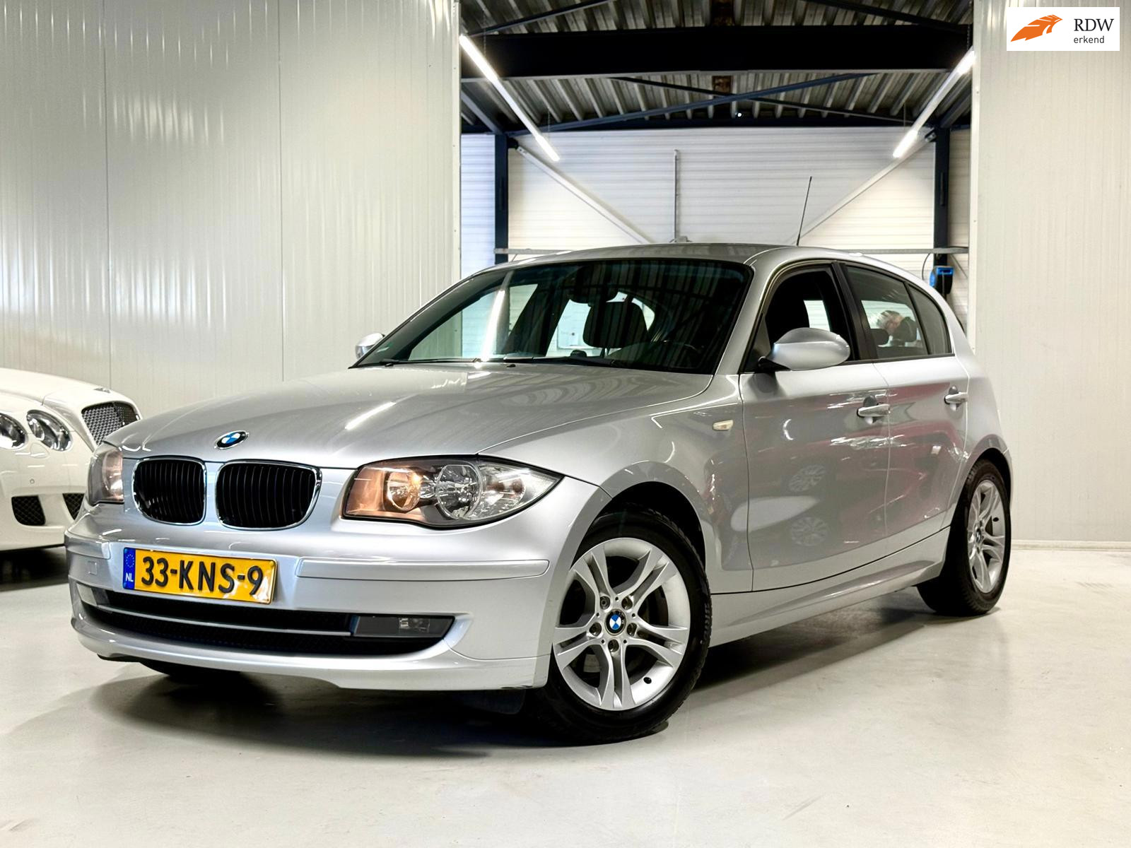 BMW 1er Reihe 116i Business Line Airco|CruiseControl!!! 2010 - voorkant