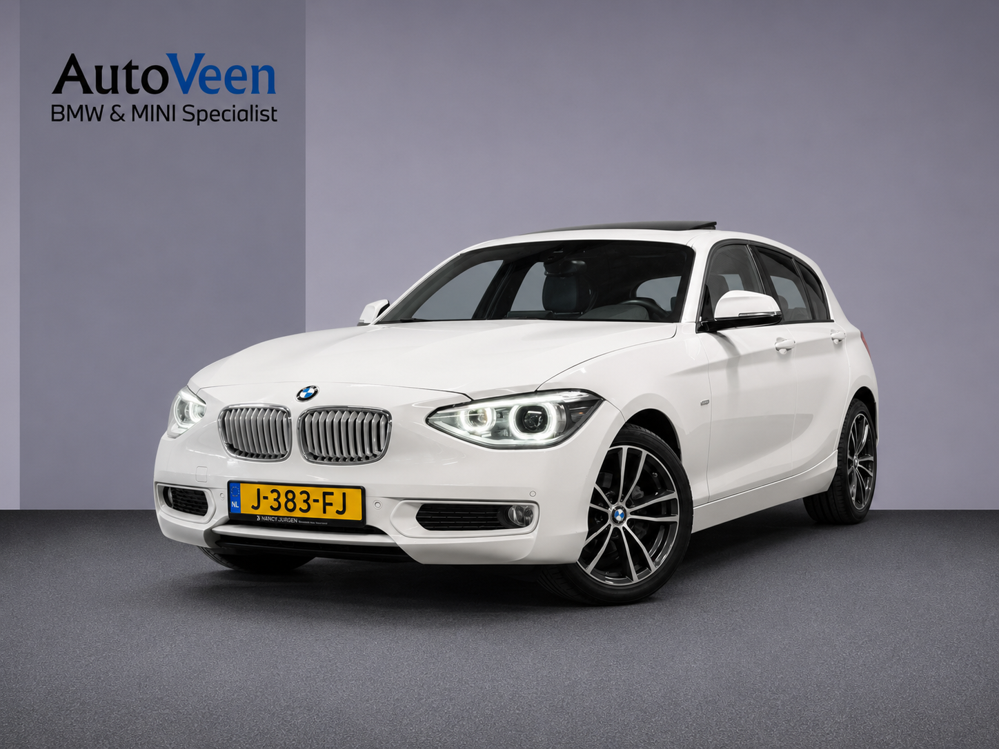 BMW 1er Reihe 116i Business+ (PANO, LED, STOELVERWARMING, NAVI, TREKHAAK, HALF LEDER) 2012 - voorkant