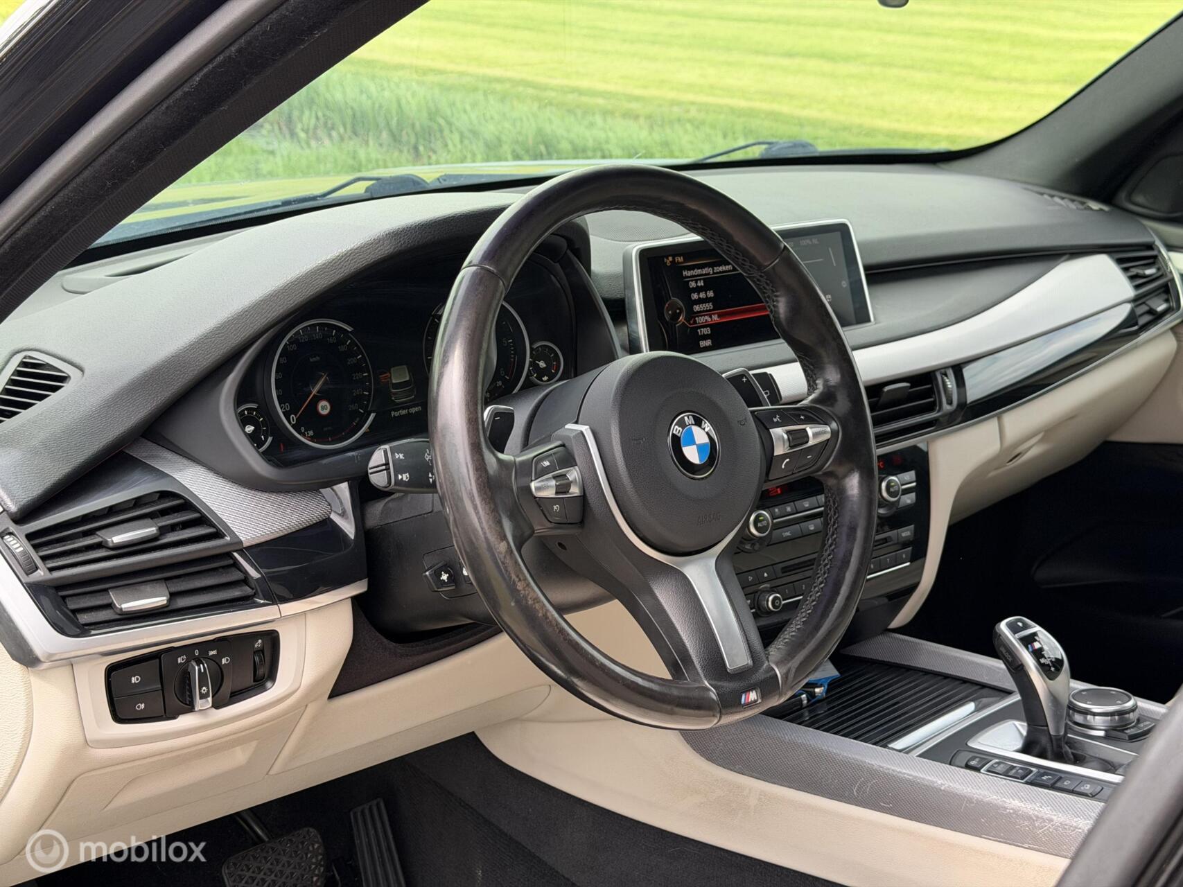 Foto van BMW X5 M50d