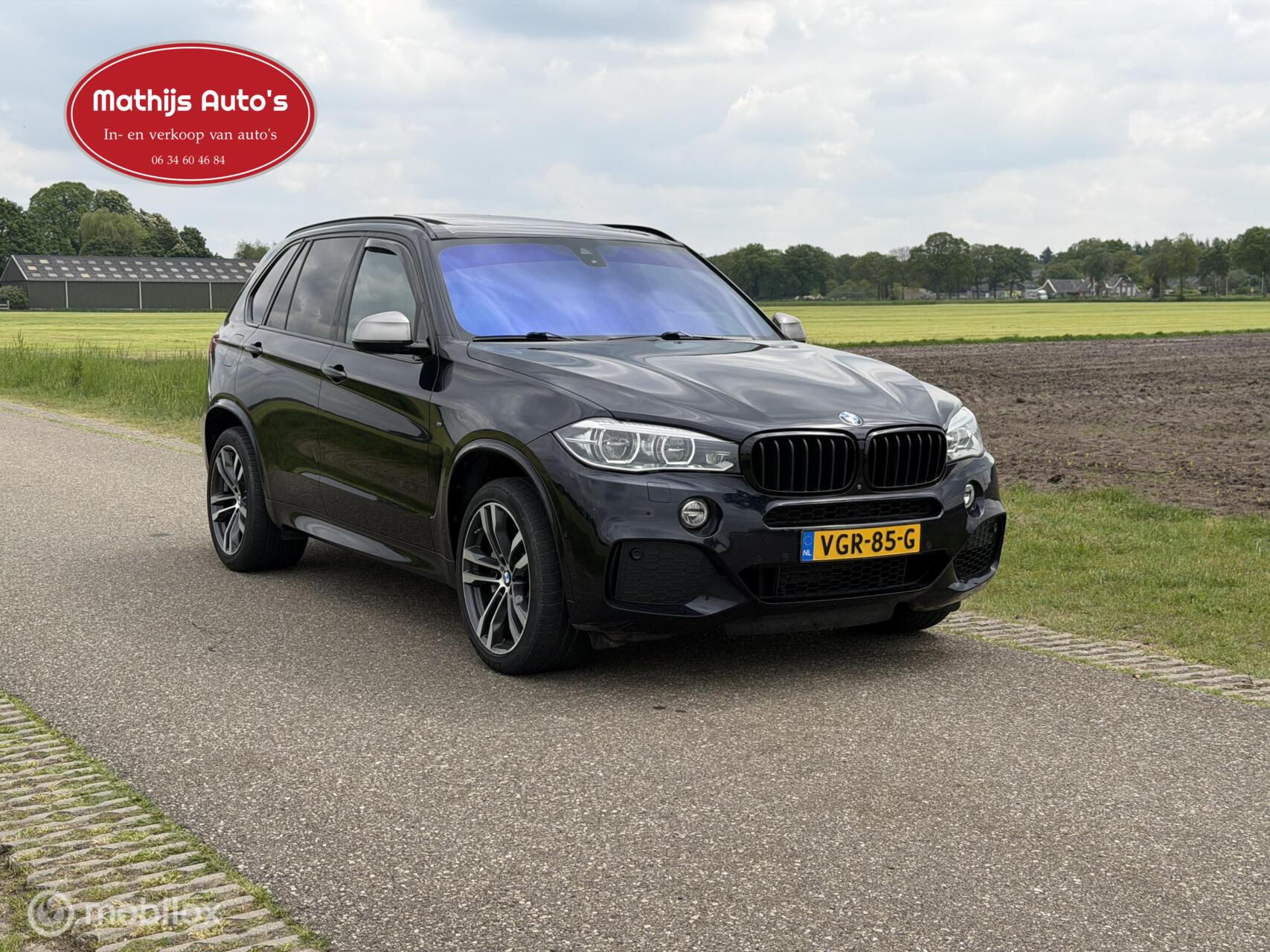 Foto van BMW X5 M50d