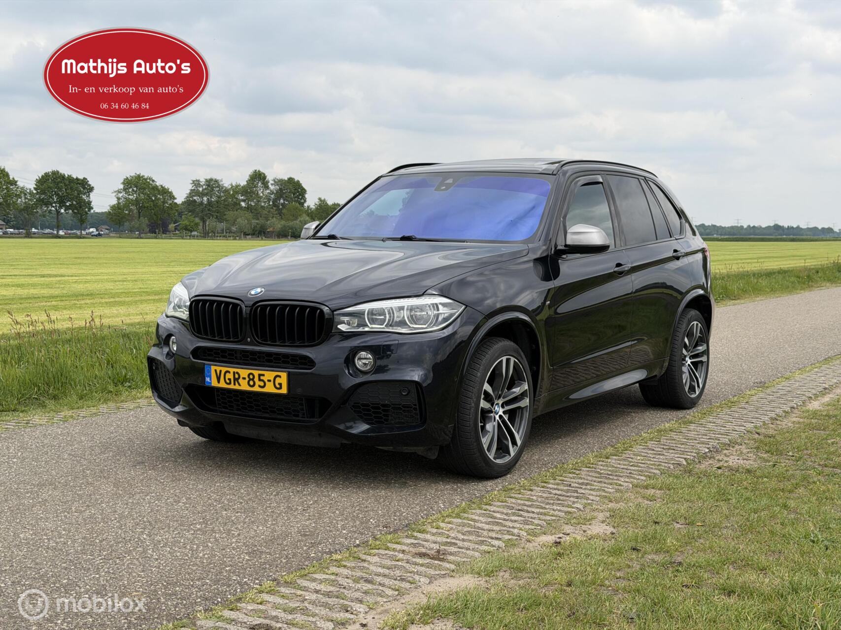 Foto van BMW X5 M50d
