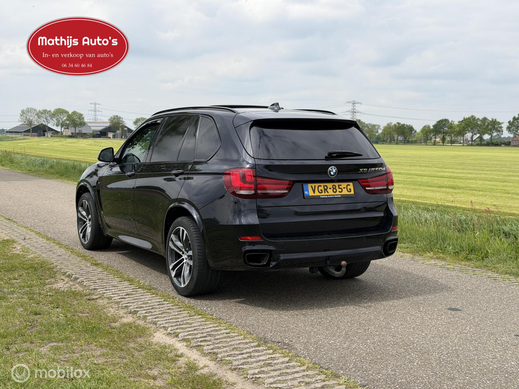 Foto van BMW X5 M50d