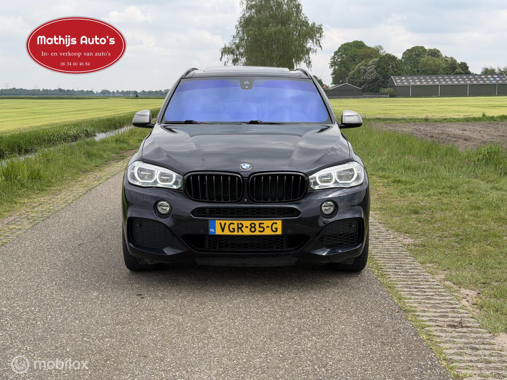 Foto van BMW X5 M50d