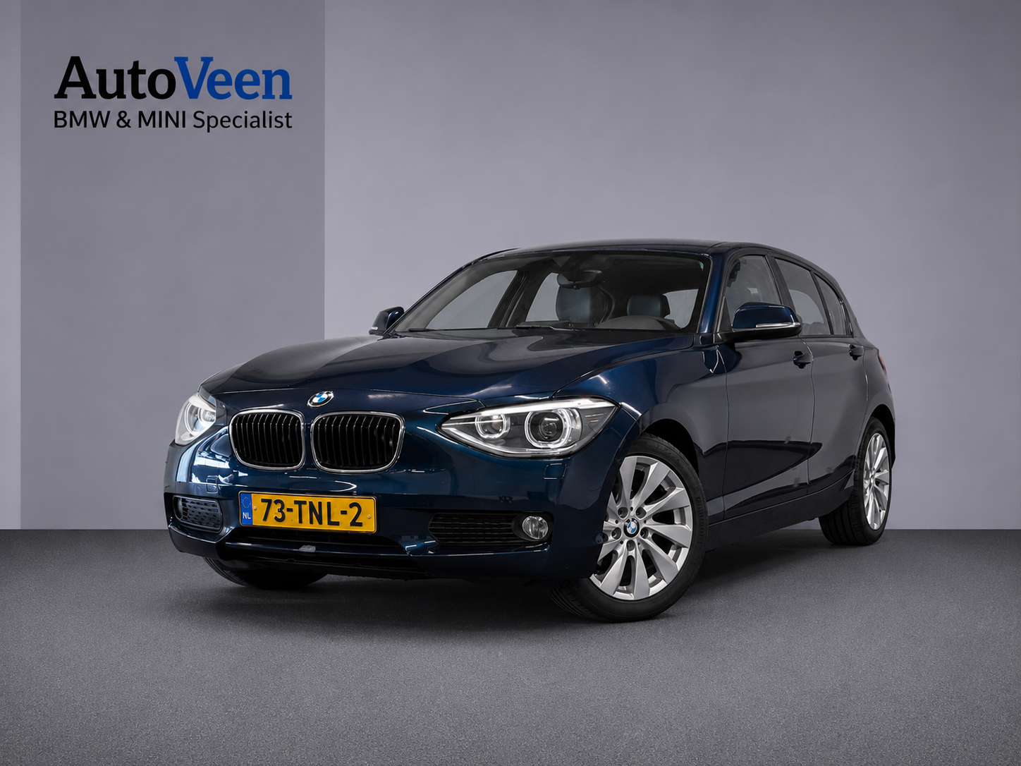 BMW 1er Reihe 116i Business+ (PANO, LEER, LED, CRUISE, H&K AUDIO, PARKEERSENSOREN) 2012 - voorkant