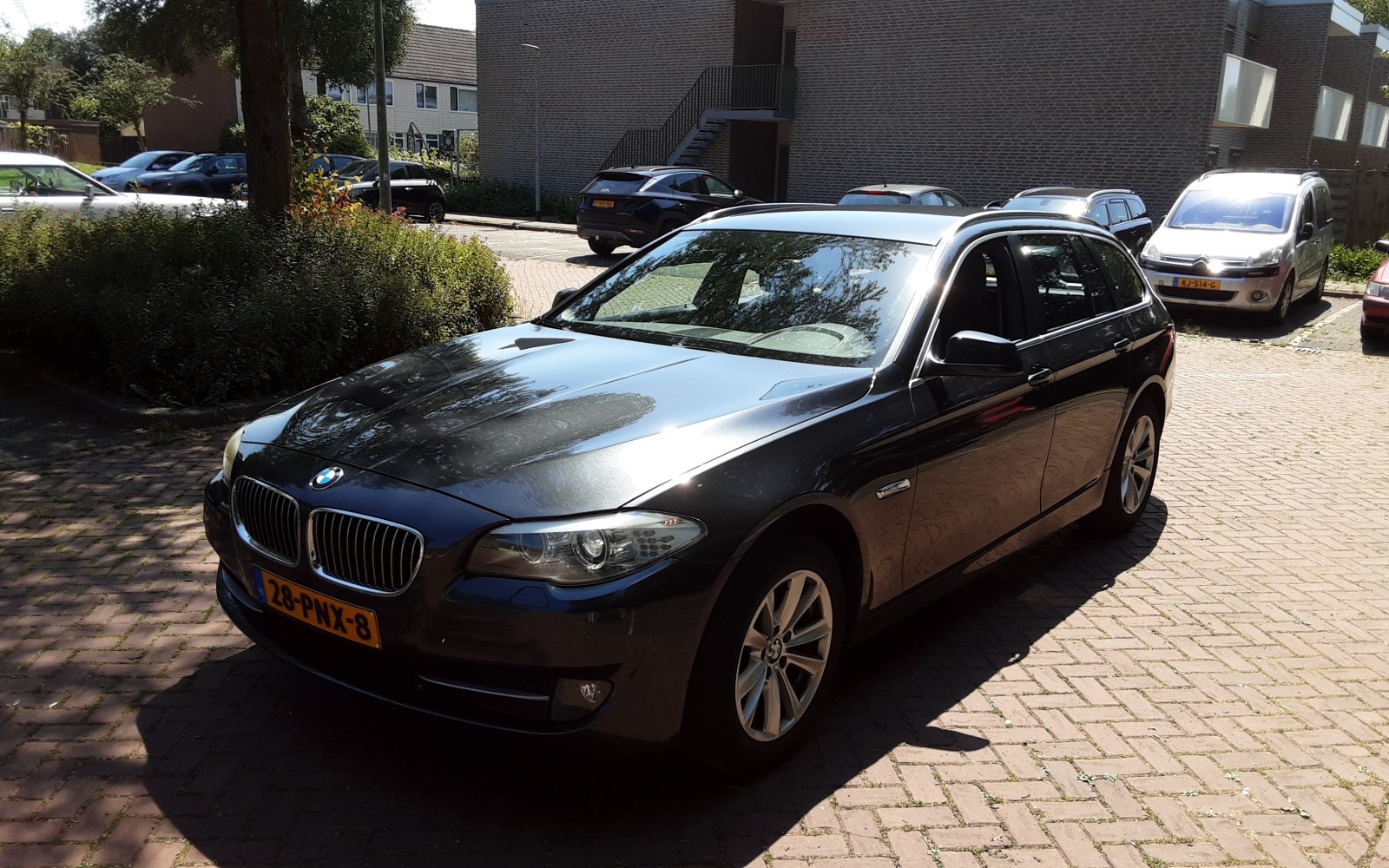 BMW 5-serie Touring 523i High Executive 2011 - voorkant