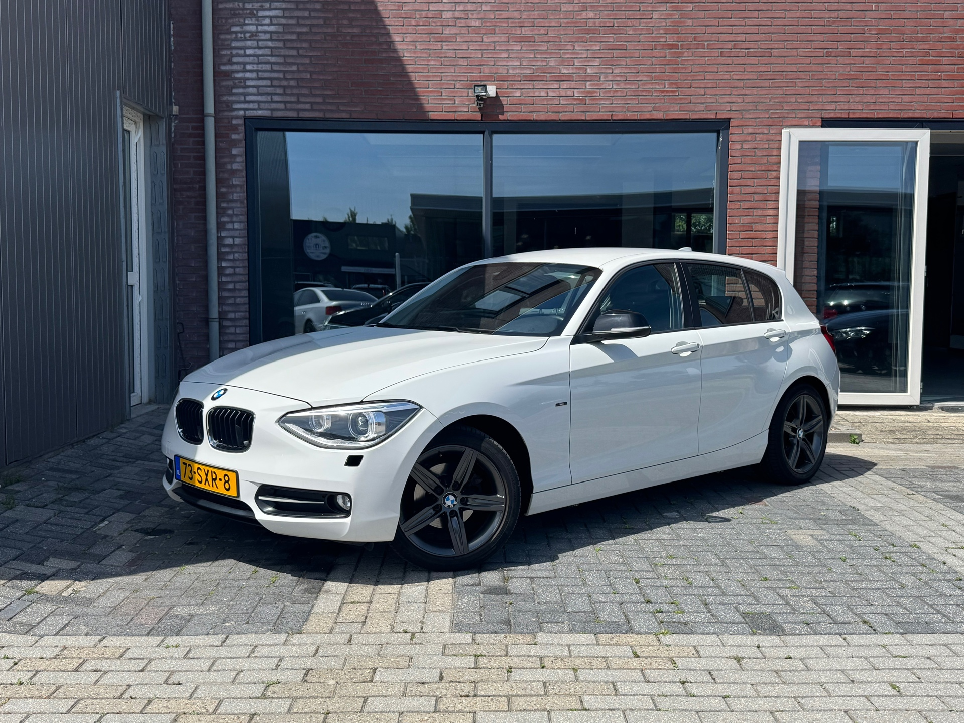 BMW 1er Reihe 116i Sport | Navi | Clima | Cruise | PDC | 2011 - voorkant