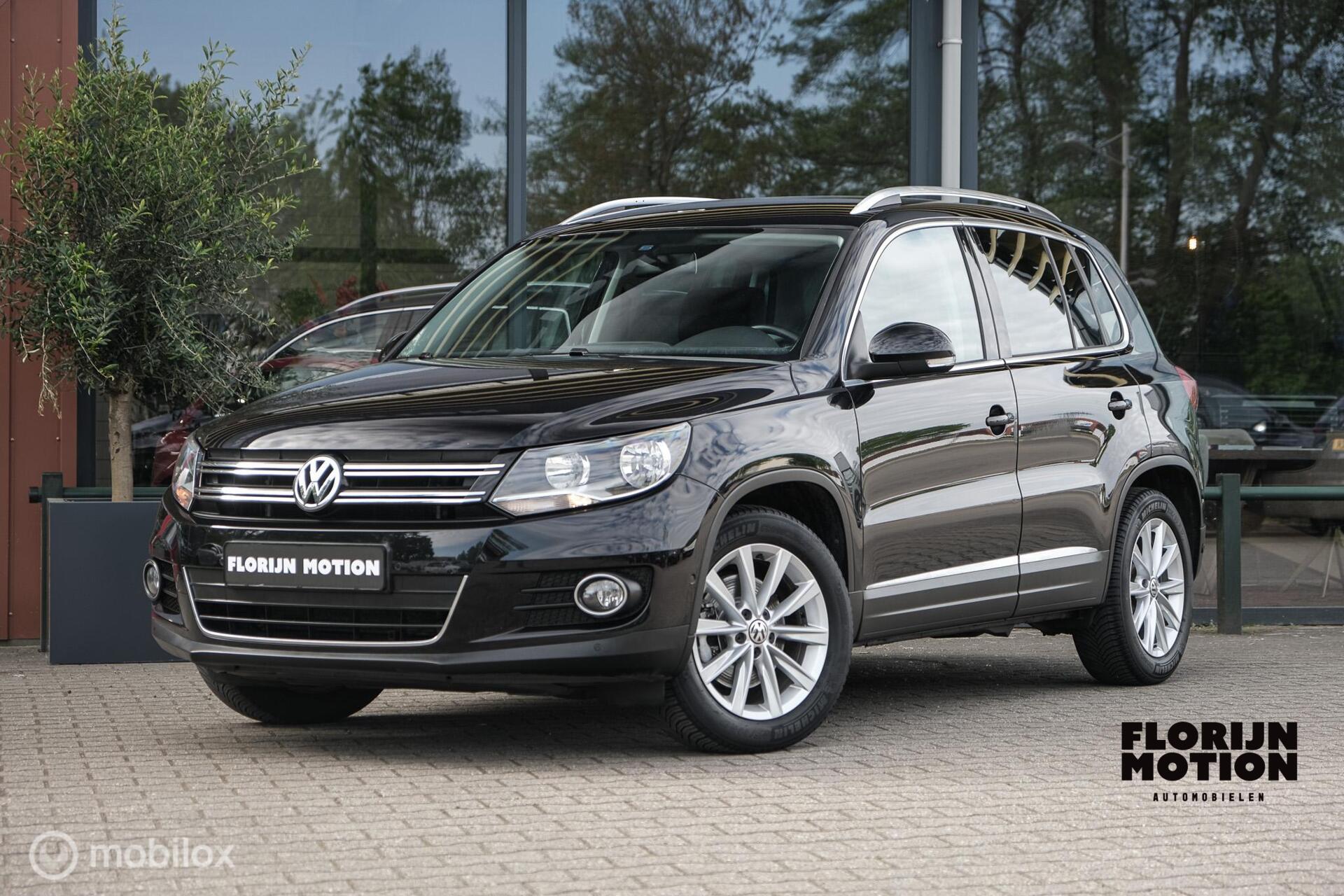Volkswagen Tiguan 1.4 TSI Sport&Style | Vol lederen interieur | Trekhaak | schermen in. hoofdsteunen | lage km | Getint glas | Cruise | Climate 2014 - voorkant