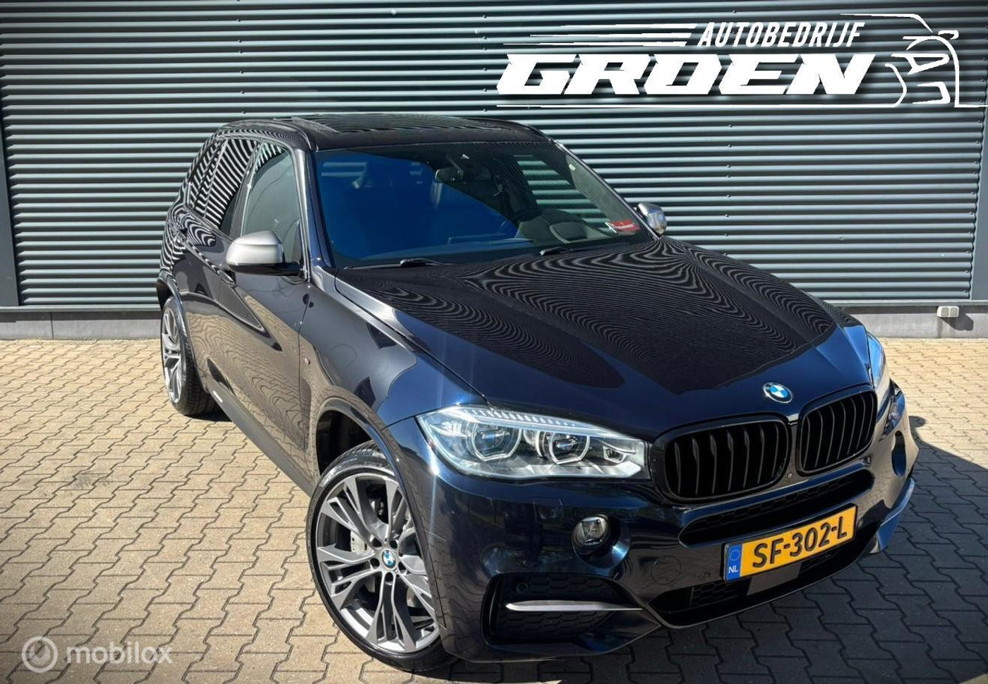 Foto van BMW X5 M50d
