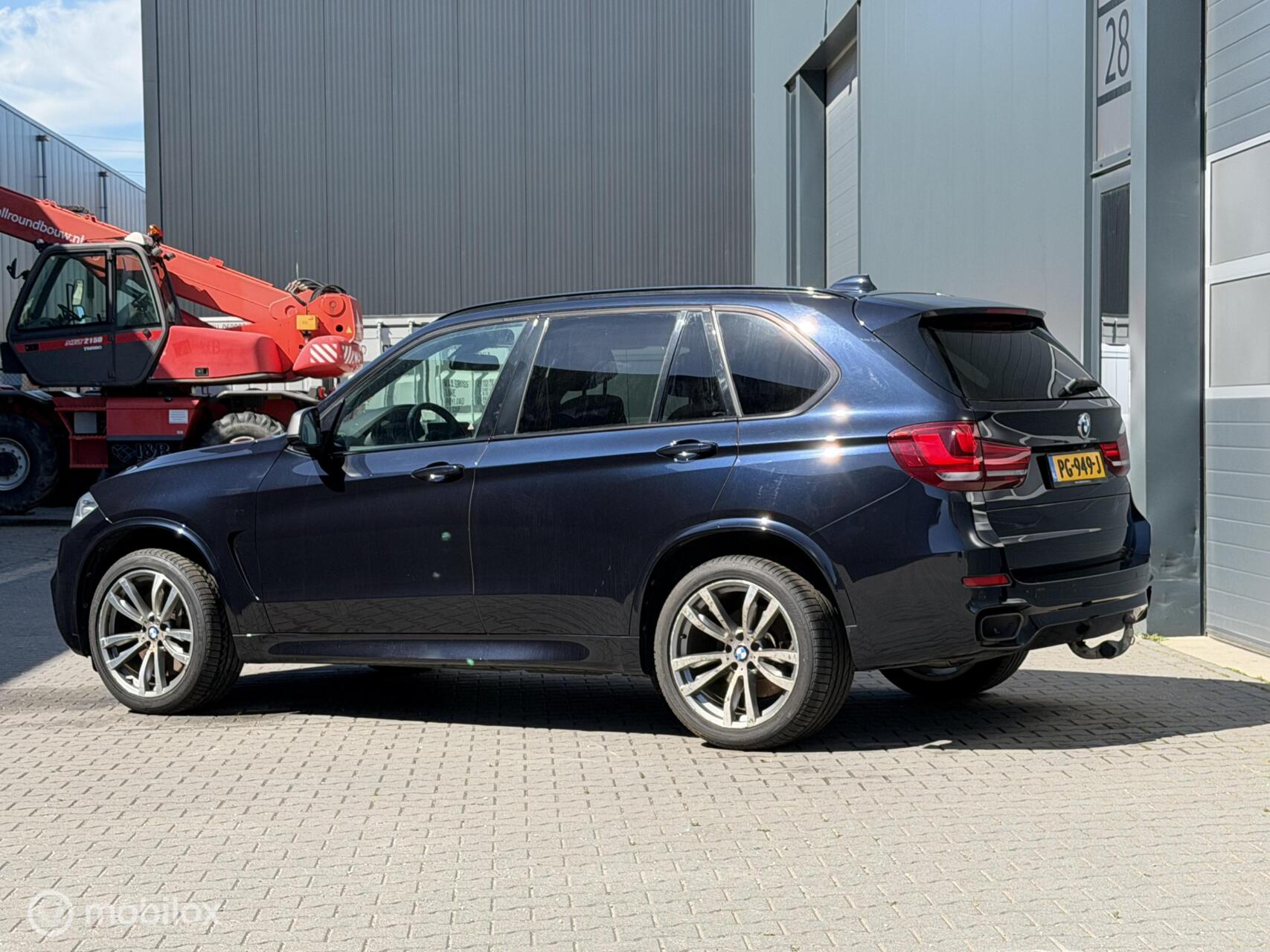 Foto van BMW X5 M50d