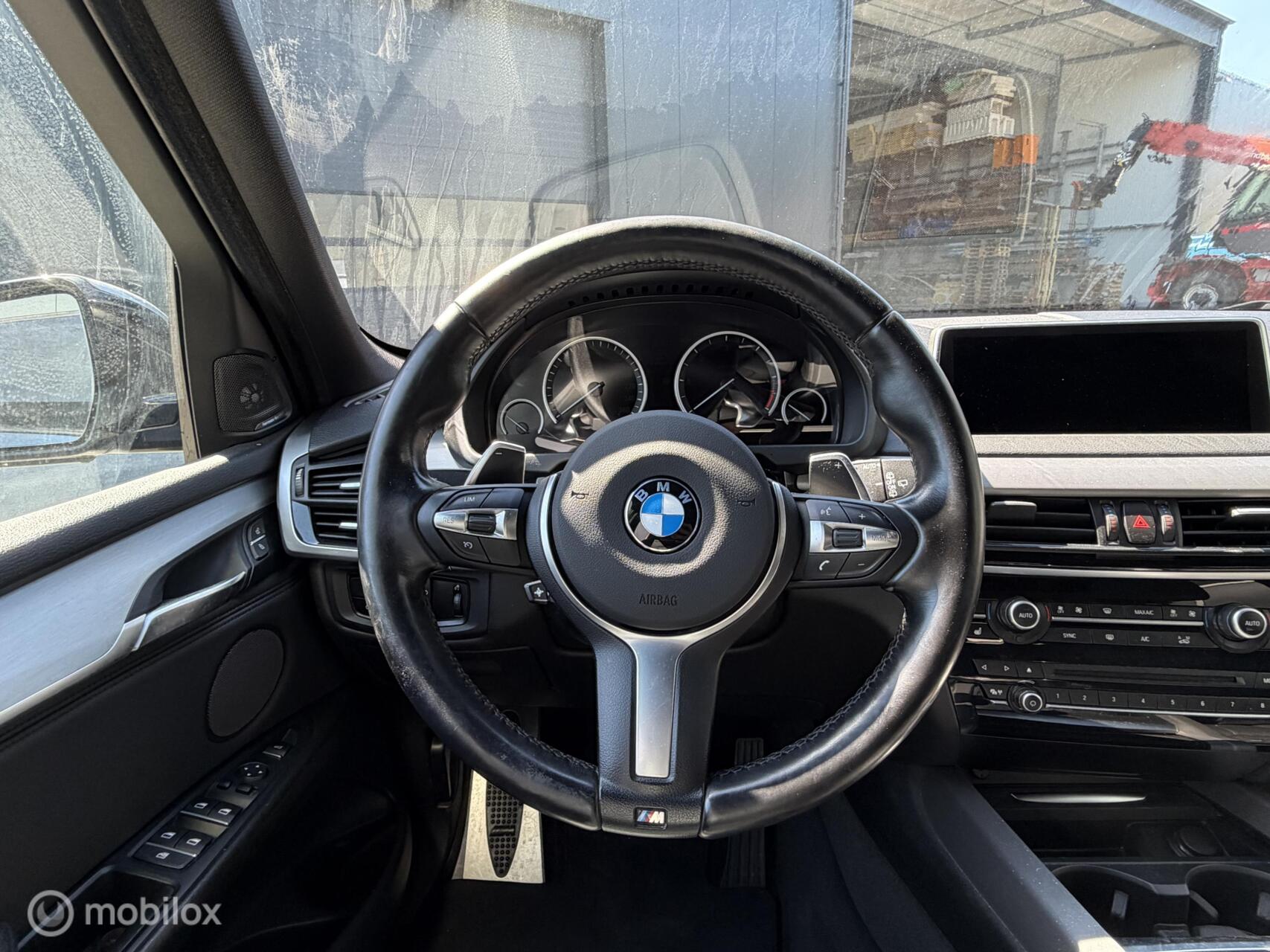 Foto van BMW X5 M50d