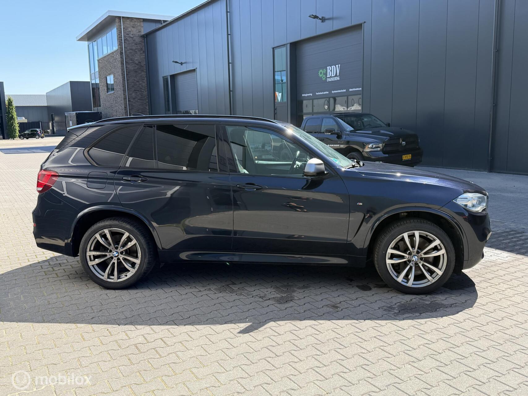 Foto van BMW X5 M50d