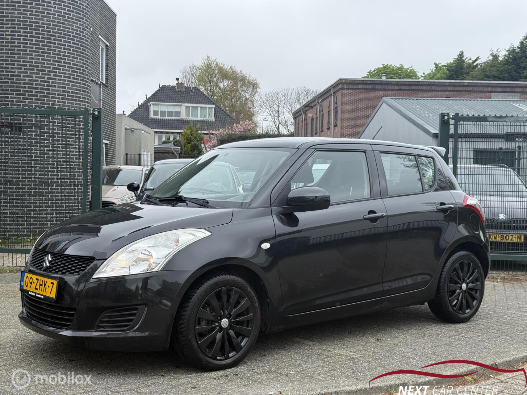 Suzuki Swift 1.2 Bandit EASSS 2012 - voorkant