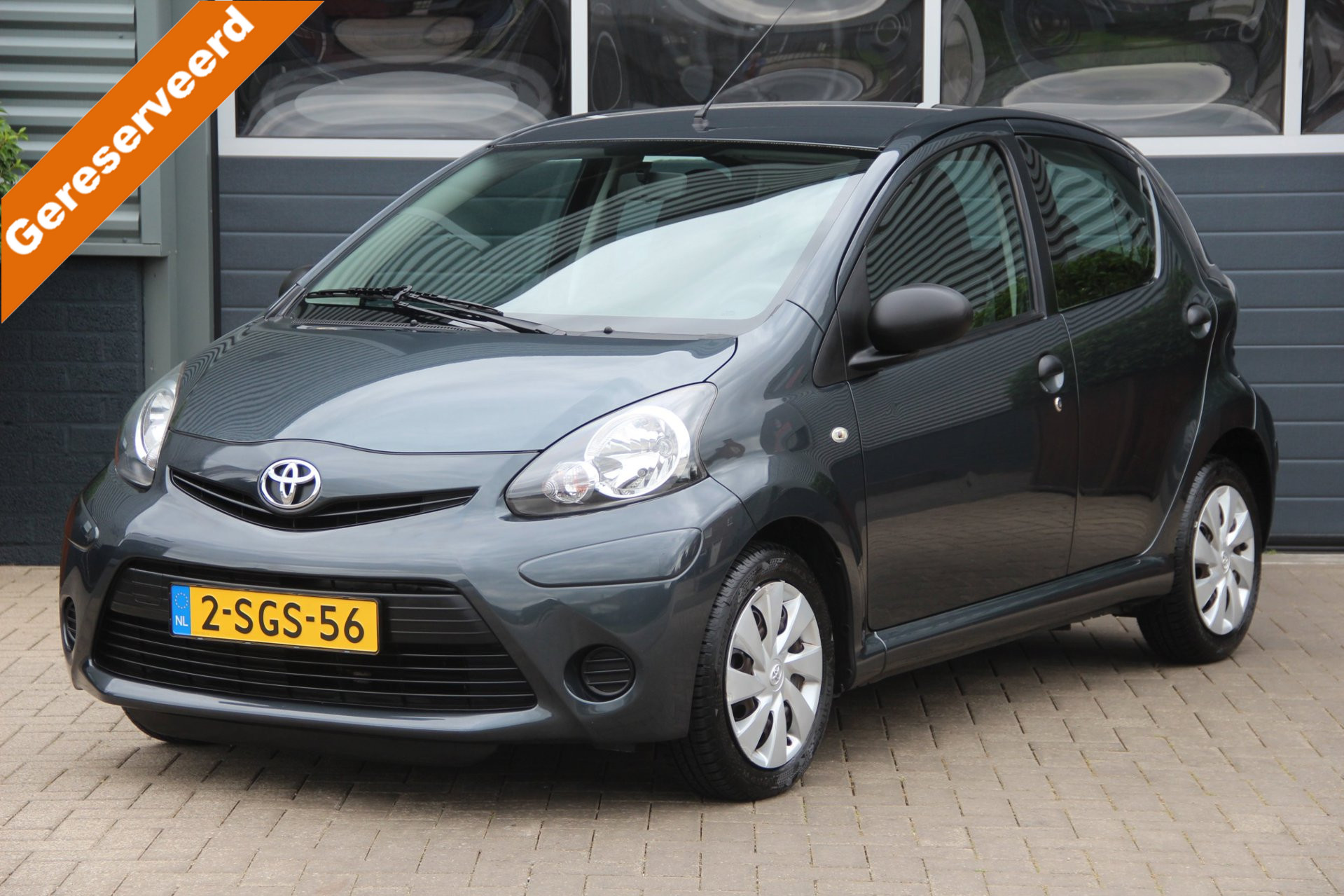Toyota Toyota Aygo 1.0 VVT-i Now NL Auto | 1e Eigenaar | Airco | Elek.Ramen | NAP | Volledig onderhouden | Radio-AUX | 5DRS | Zeer nette 2013 - voorkant
