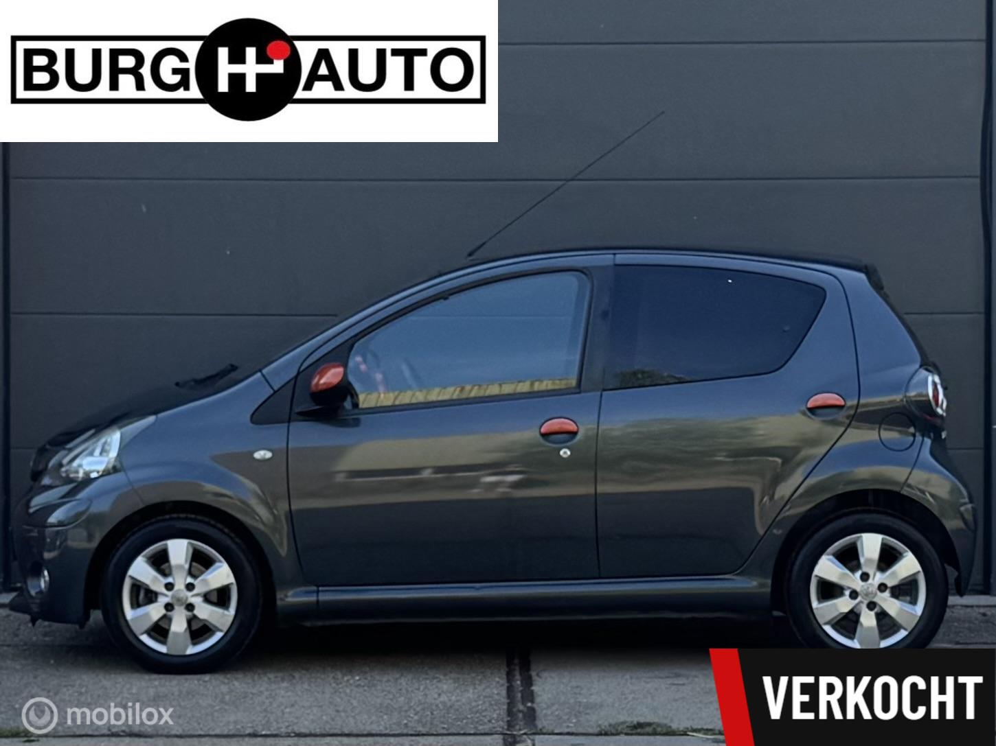 Toyota Toyota Aygo 1.0 VVT-i Dynamic Orange 5 deurs - AIRCO - LM VELGEN - EL. RAMEN - BLUETOOTH - CPV -  LEDER STUUR - LED - NAP - NL AUTO - NIEUWE APK BIJ AFLEVERING - 2012 - voorkant