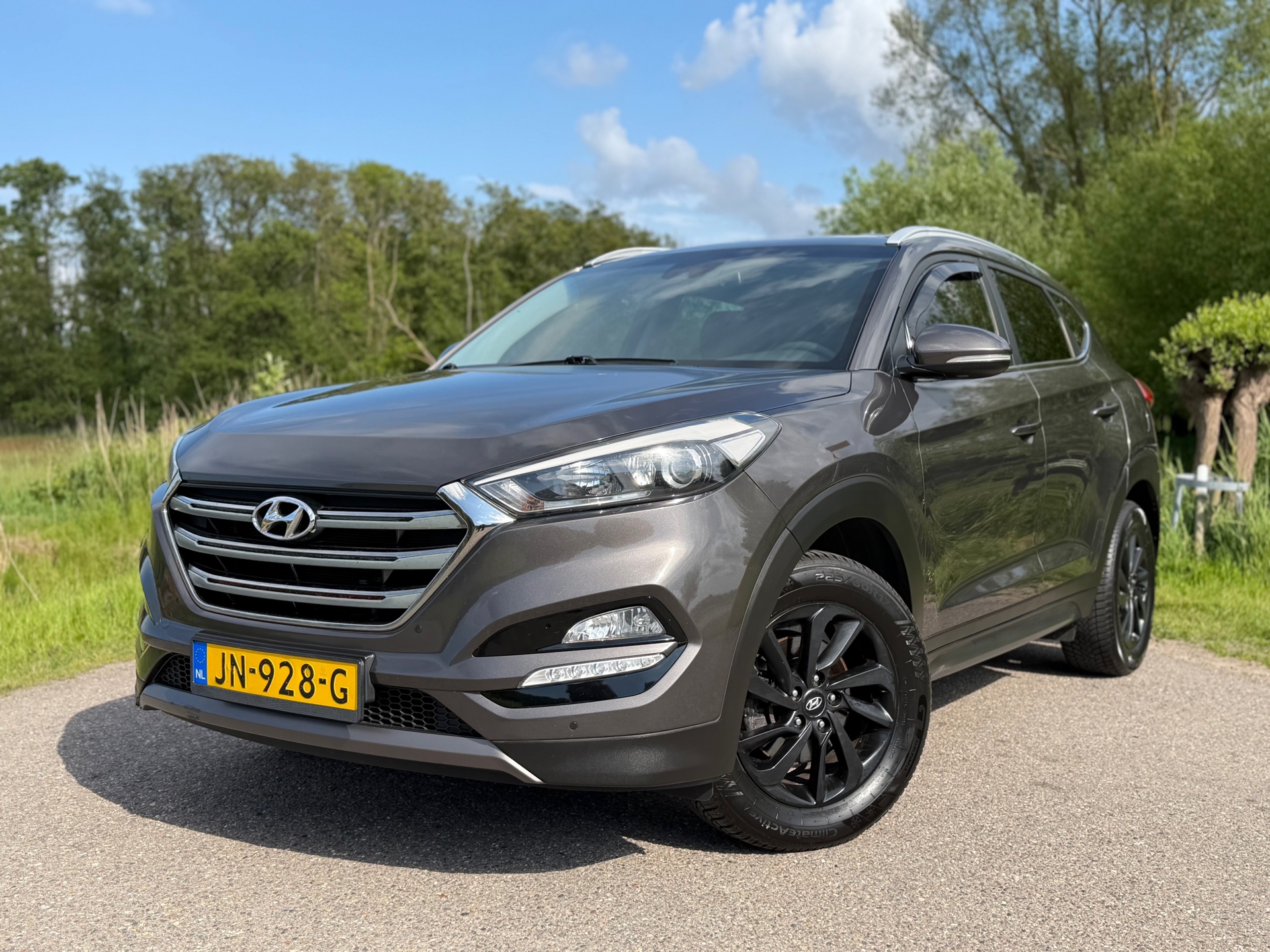 Hyundai Tucson 1.6 GDi Comfort / Navigatie / Camera / Cruise Control / Climate Control / Stoelverwarming / 17"LM Velgen 2016 - voorkant