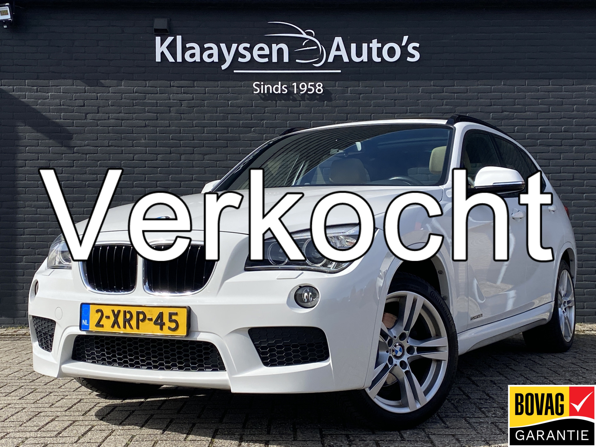 BMW X1 Sdrive20i sDrive20i High Executive 184 pk AUT. | panoramadak | navigatie | trekhaak | beige leder interieur | sportstoelen 2014 - voorkant