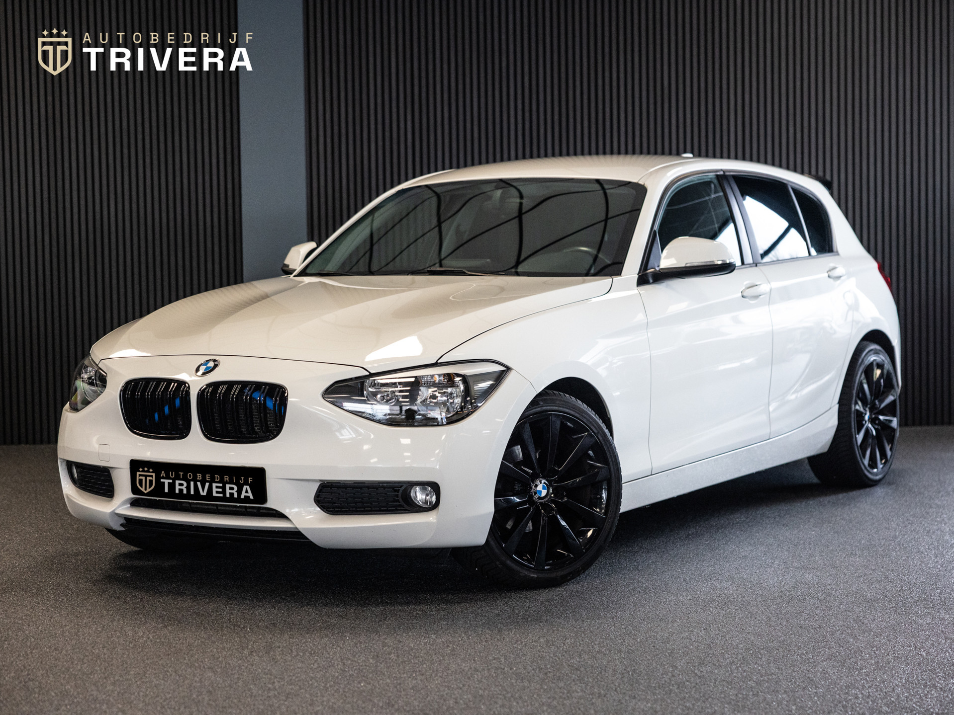 BMW 1er Reihe 116i Business+ l LMV l Apple carplay l strakke auto 2012 - voorkant