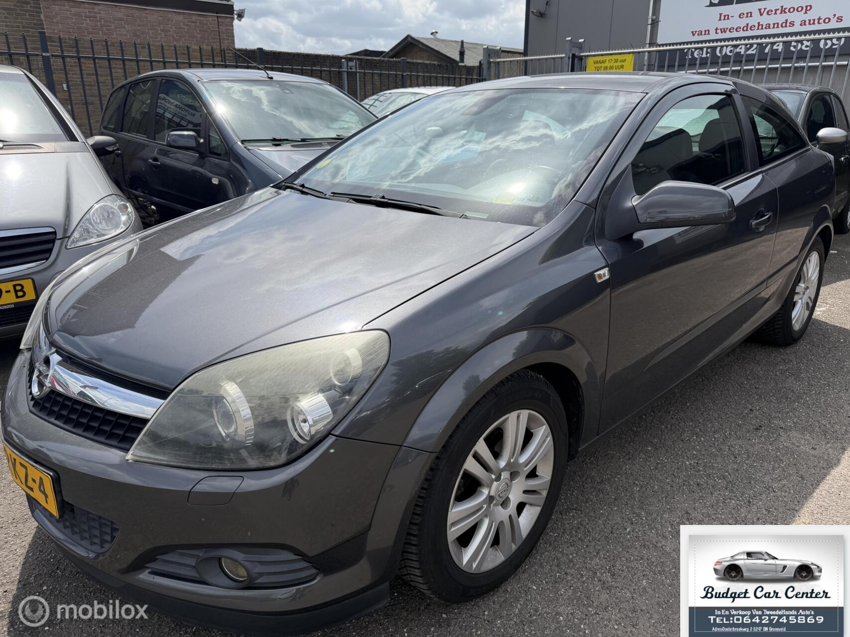 Opel Astra GTC 1.4 Business SCHADE 2009 - voorkant