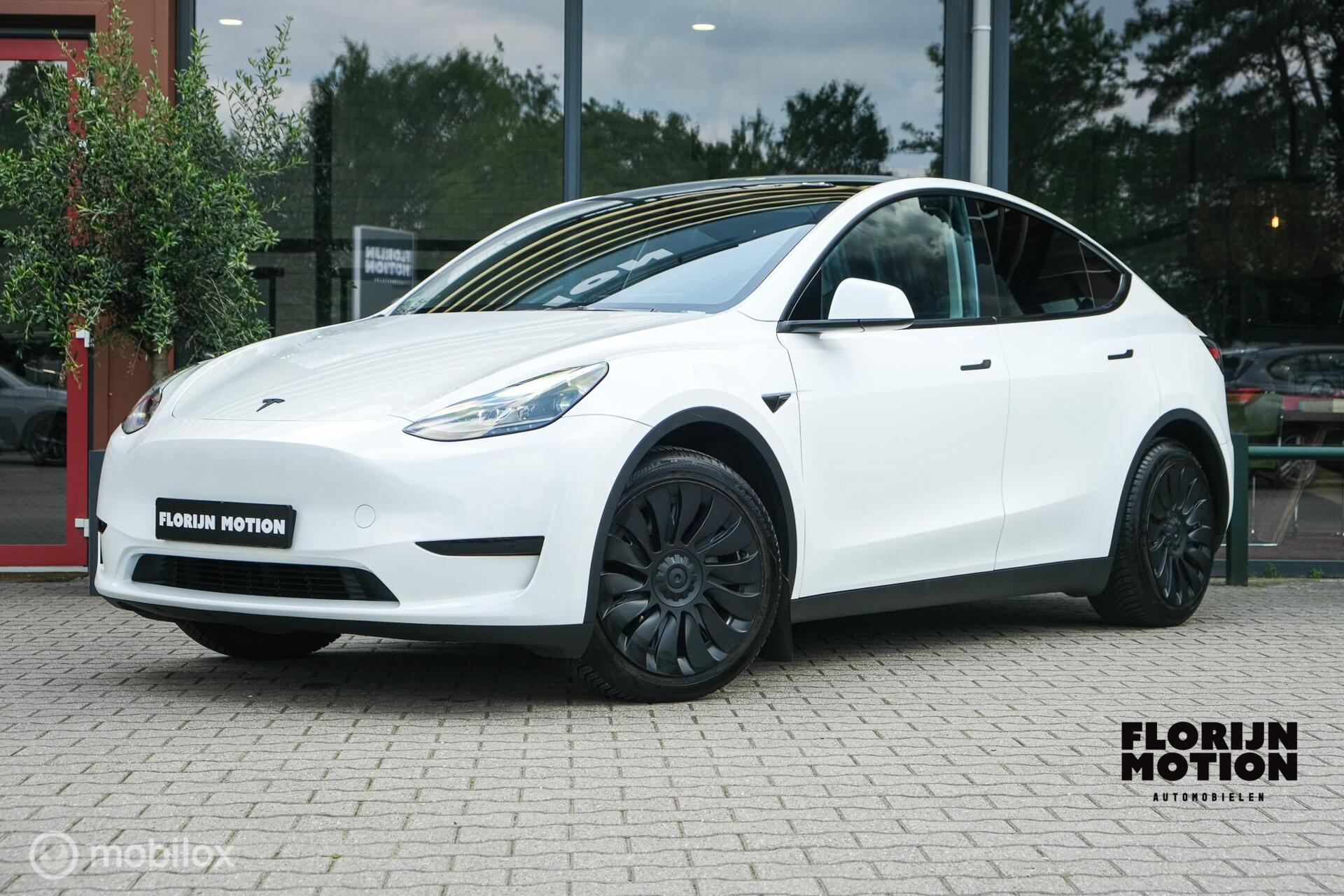 Tesla Model Y RWD 58 kWh | Autopilot  3.0 Ryzen | Stoel en stuurwielverw. | 1e eigenaar |  Premium interieur | Pearl White | Spoiler | LFP batterij | SOH 93% 2023 - voorkant