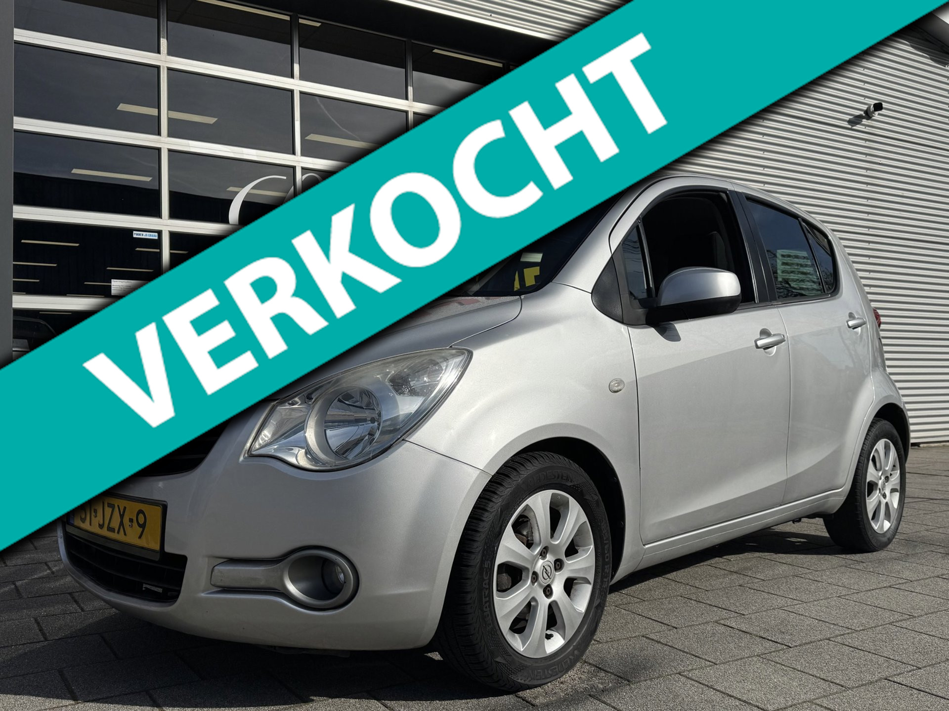 Opel Agila 1.0 Enjoy - 5Drs I Airco I Sport velgen I Comfort pakket I 80.000 KM - Dealer onderhouden 2009 - voorkant