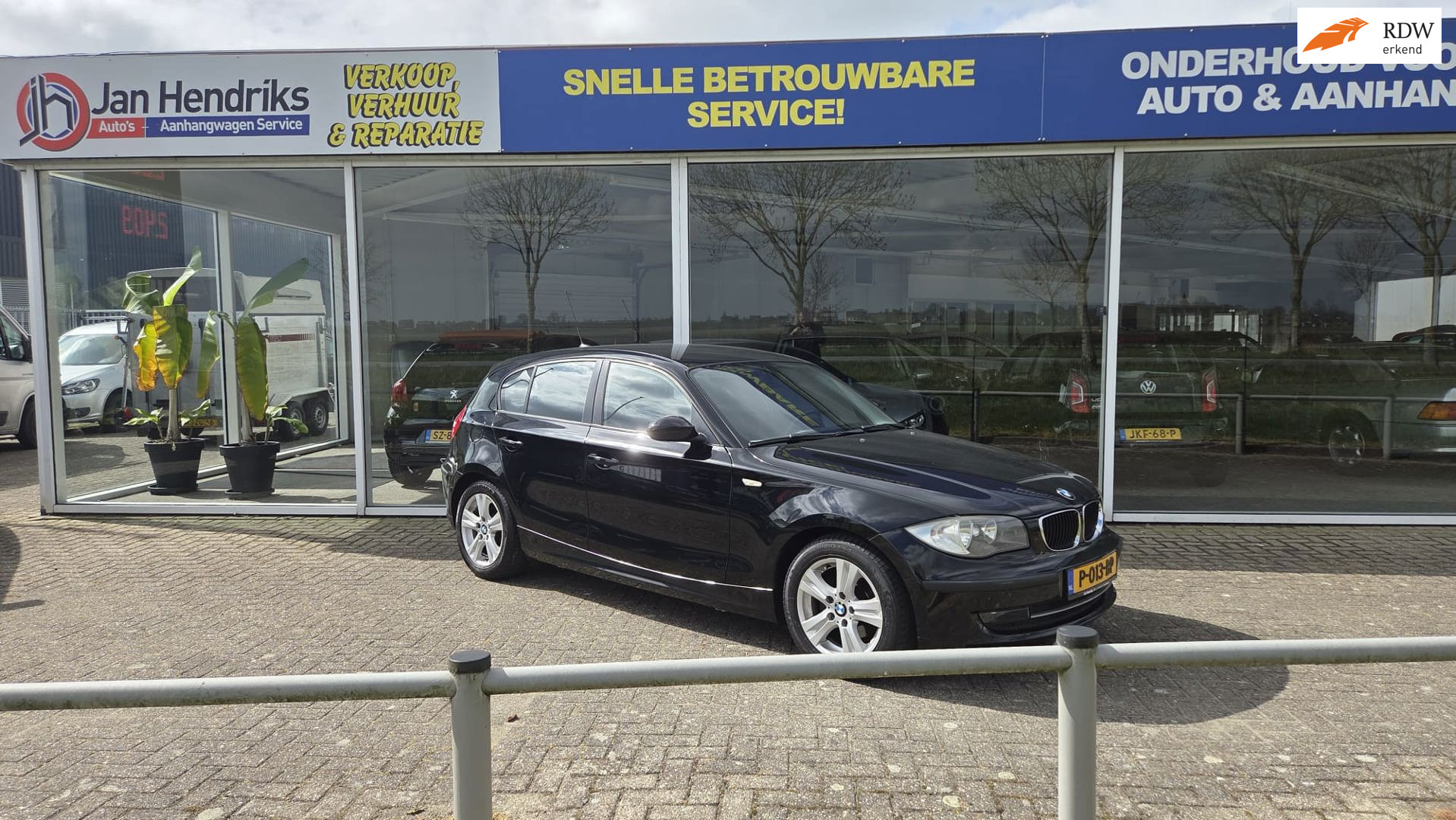 BMW 1er Reihe 116i 2009 - voorkant