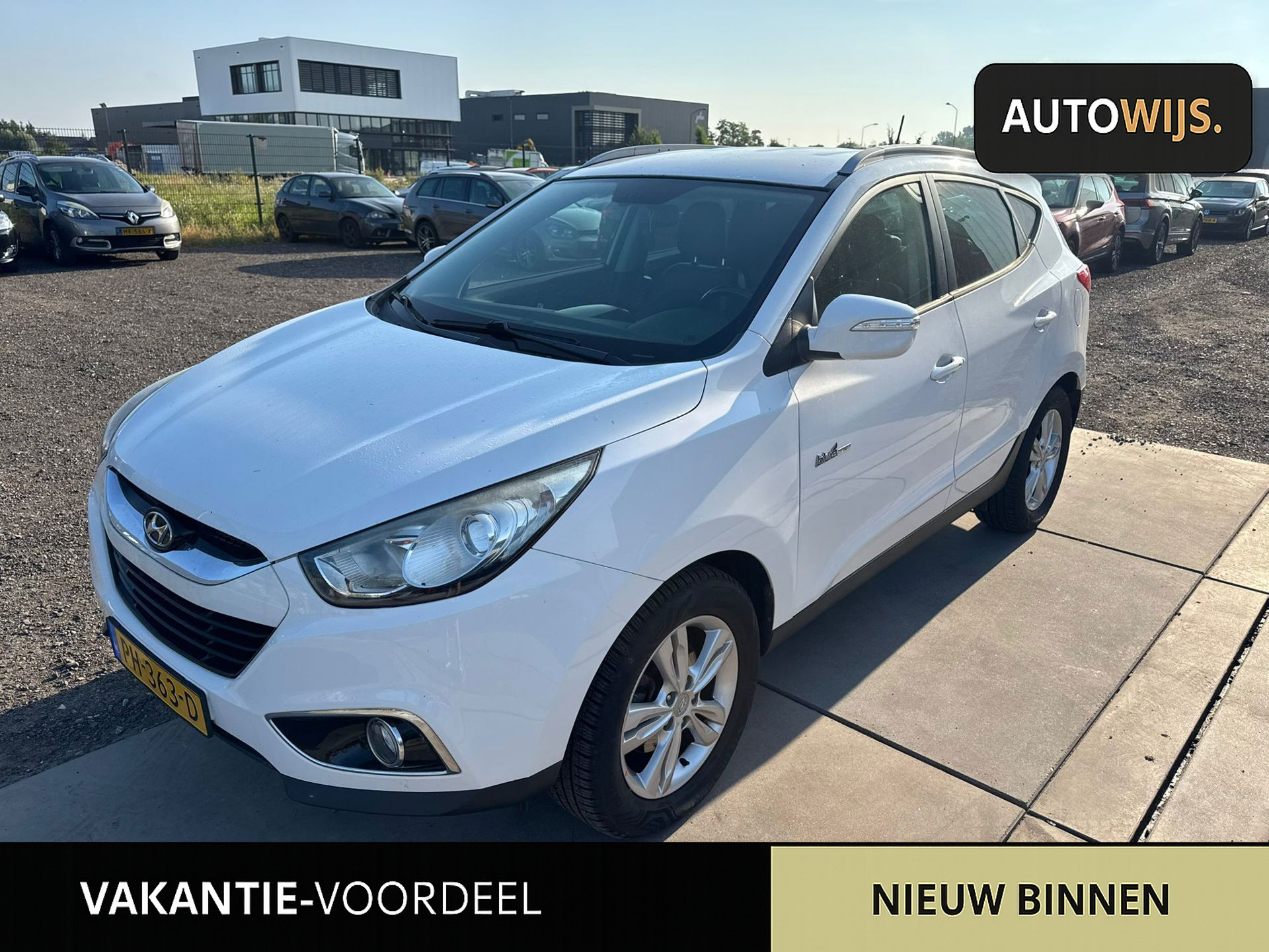 Hyundai Tucson 1.6i GDI Business Edition|CAMERA|NAVI|HALF LEER|CLIMA|GOED ONDERHOUDEN 2013 - voorkant