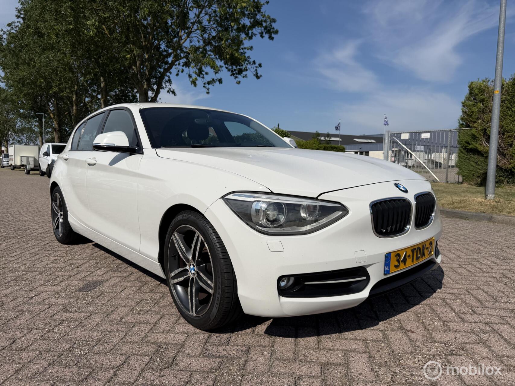BMW 1er Reihe 116i Business+ Eerste Eigenaar! 2012 - voorkant