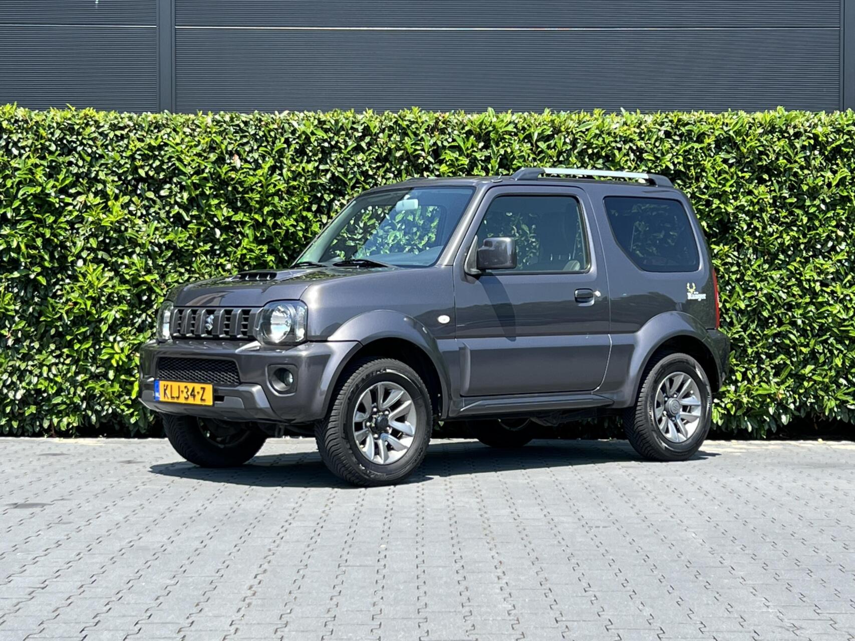 Suzuki Jimny 1.3 Exclusive RANGER, LEDER, AIRCO, STOELVERWARMING, TREKHAAK, LICHTMETAAL 15" 2017 - voorkant