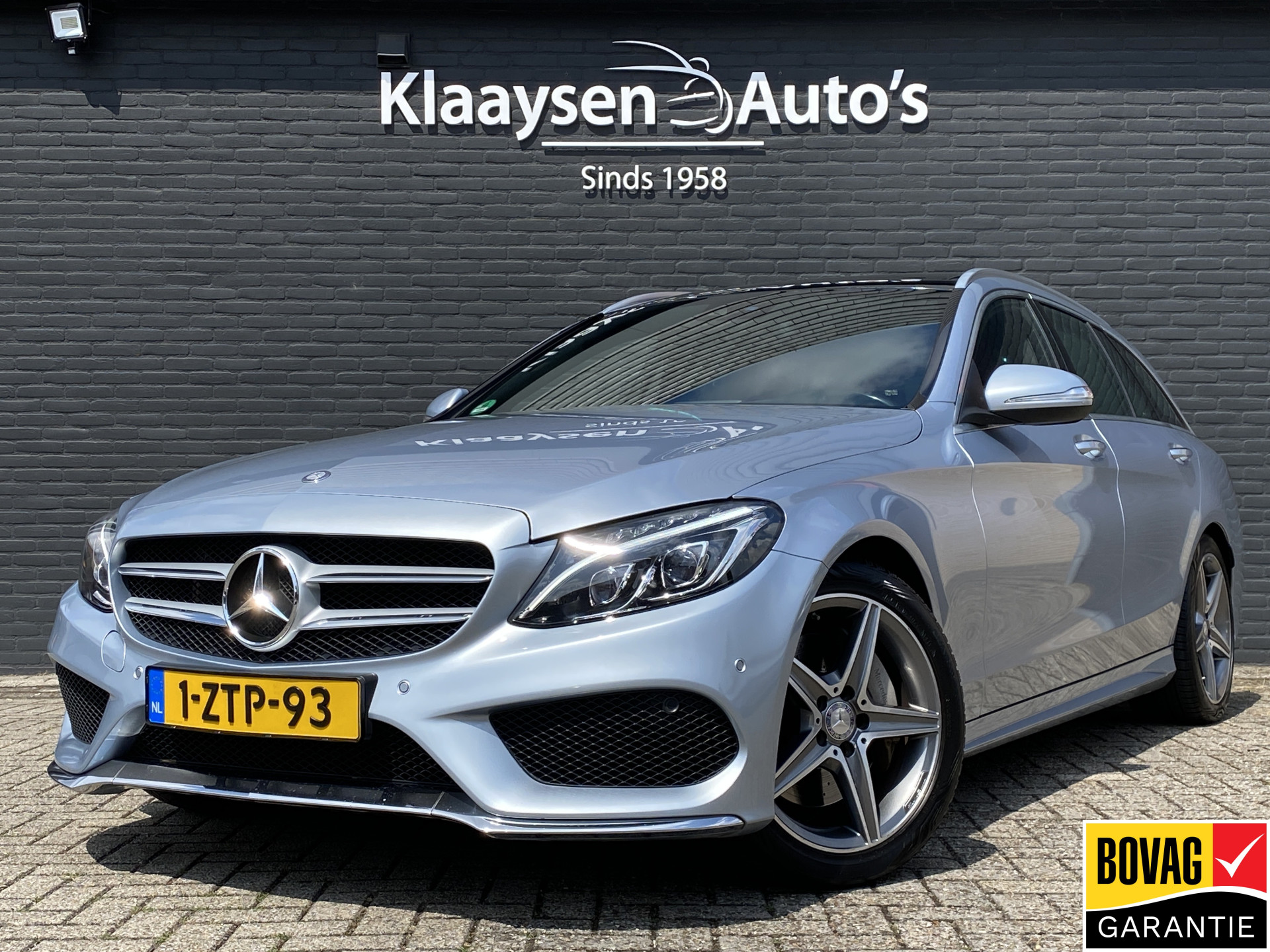 Mercedes-Benz C 250 250 AMG 211 pk AUT. | dealer onderh. | rood leder | panoramadak | burmester audio | trekhaak | memory seats 2015 - voorkant