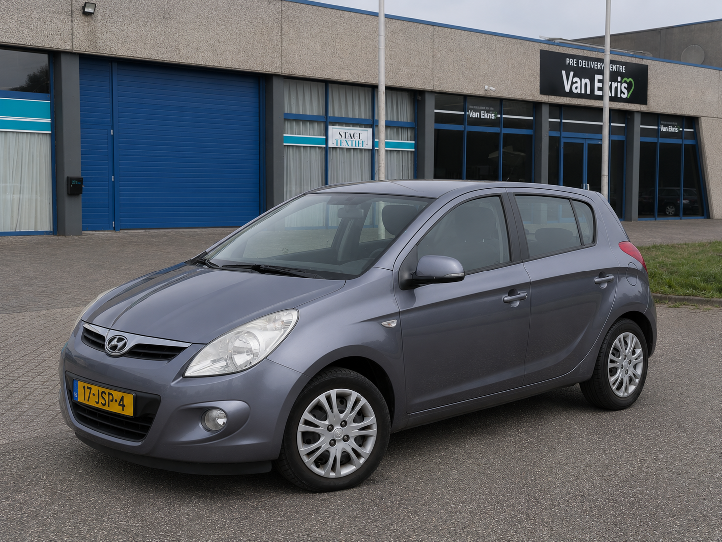 Hyundai I20 1.4i 2009 5-DRS Airco Cruise Aux NL Auto 2009 - voorkant